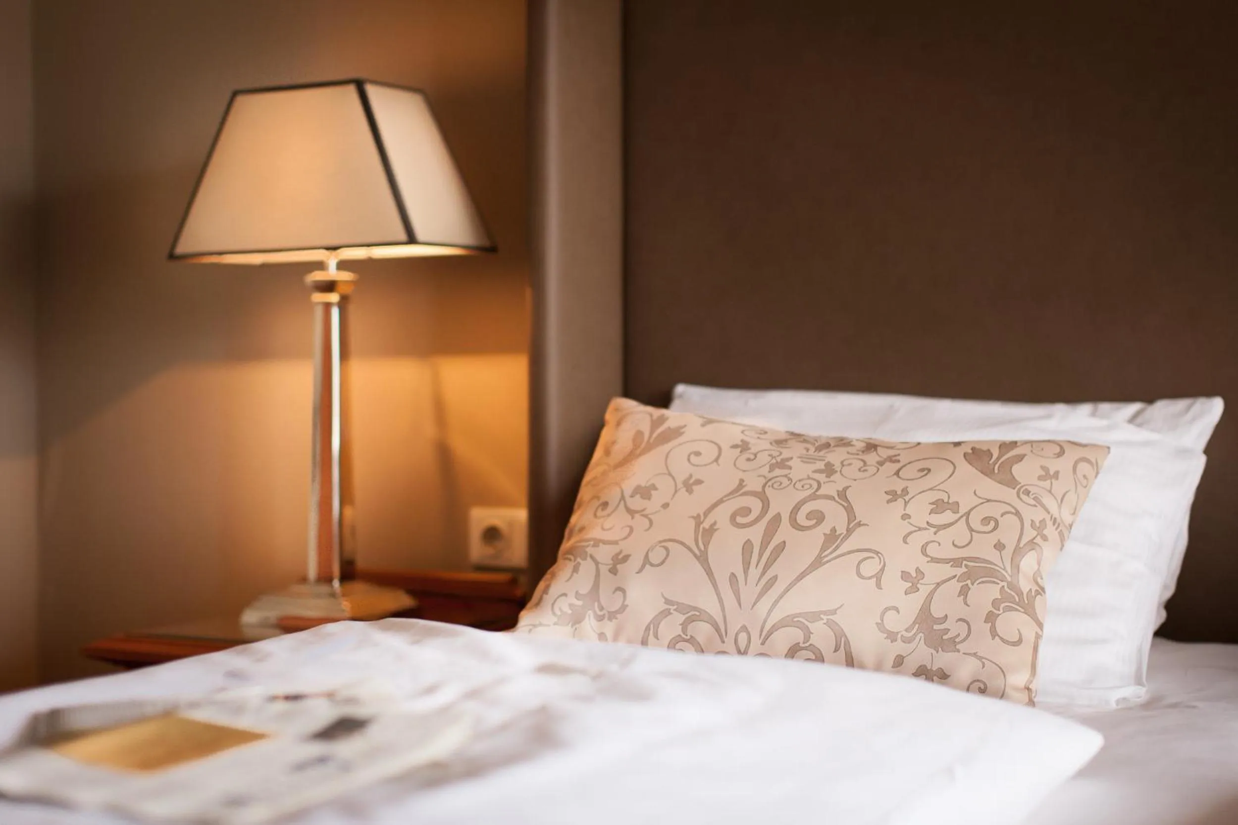 Bed in The Ascot Hotel