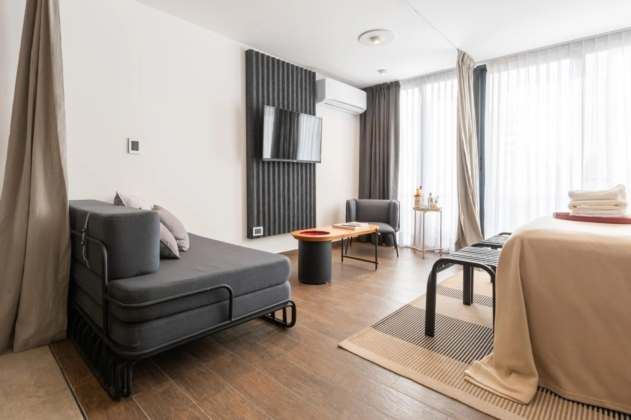 Seating area, Bed in Stay Suites