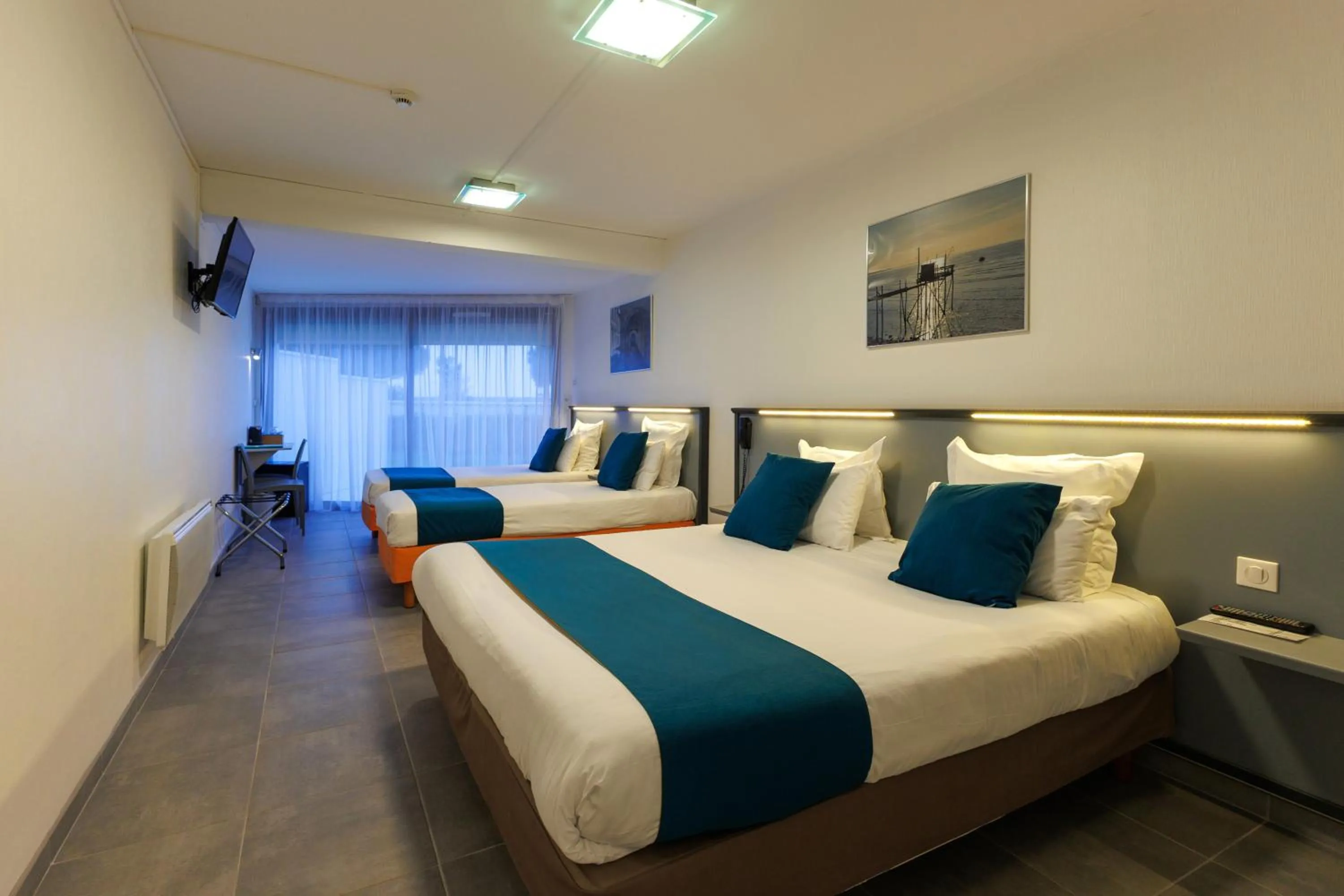 Photo of the whole room, Bed in Logis Hôtel Le Rochelois