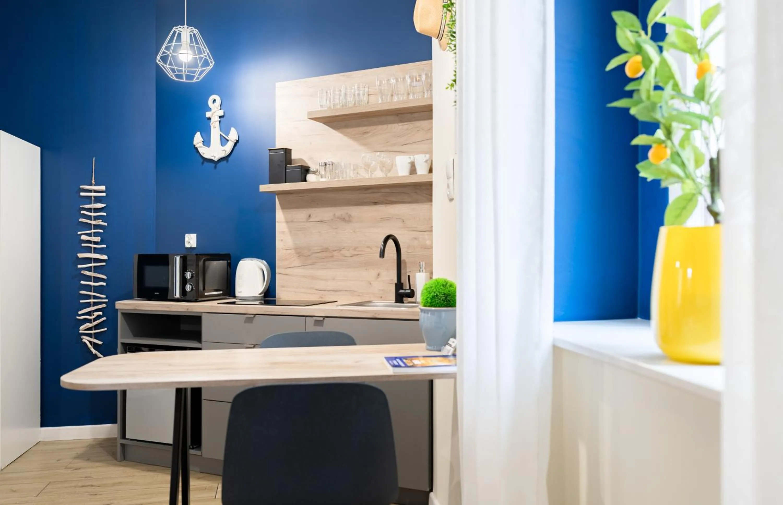 Kitchen or kitchenette in Aparthotel przy Bulwarze by Rentoom