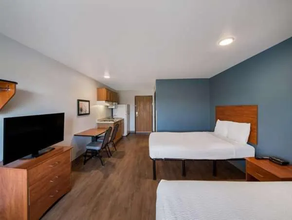 Bed in WoodSpring Suites Fort Worth Trophy Club