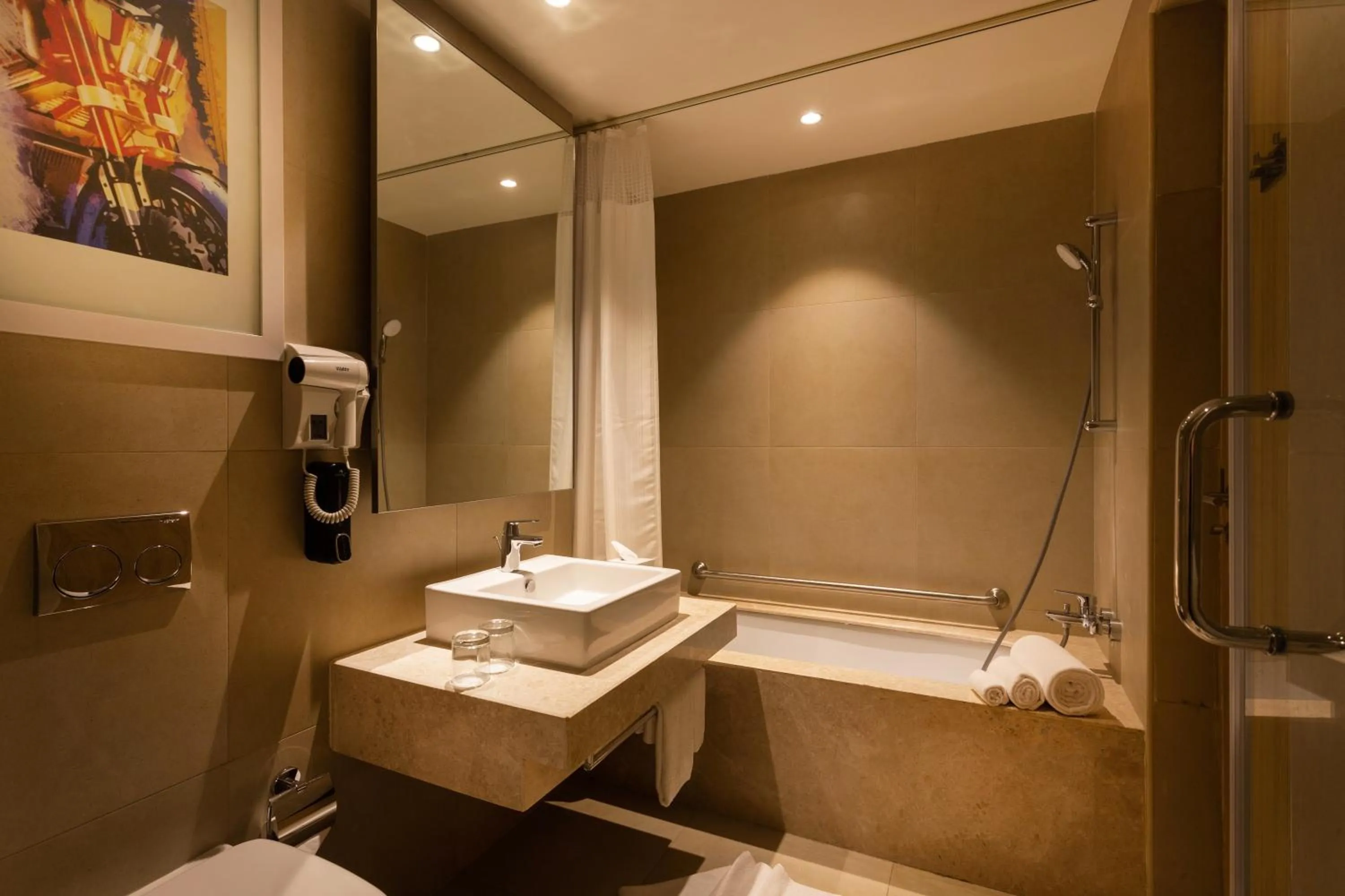 Bathroom in Holiday Inn Express & Suites Bengaluru Old Madras Road by IHG
