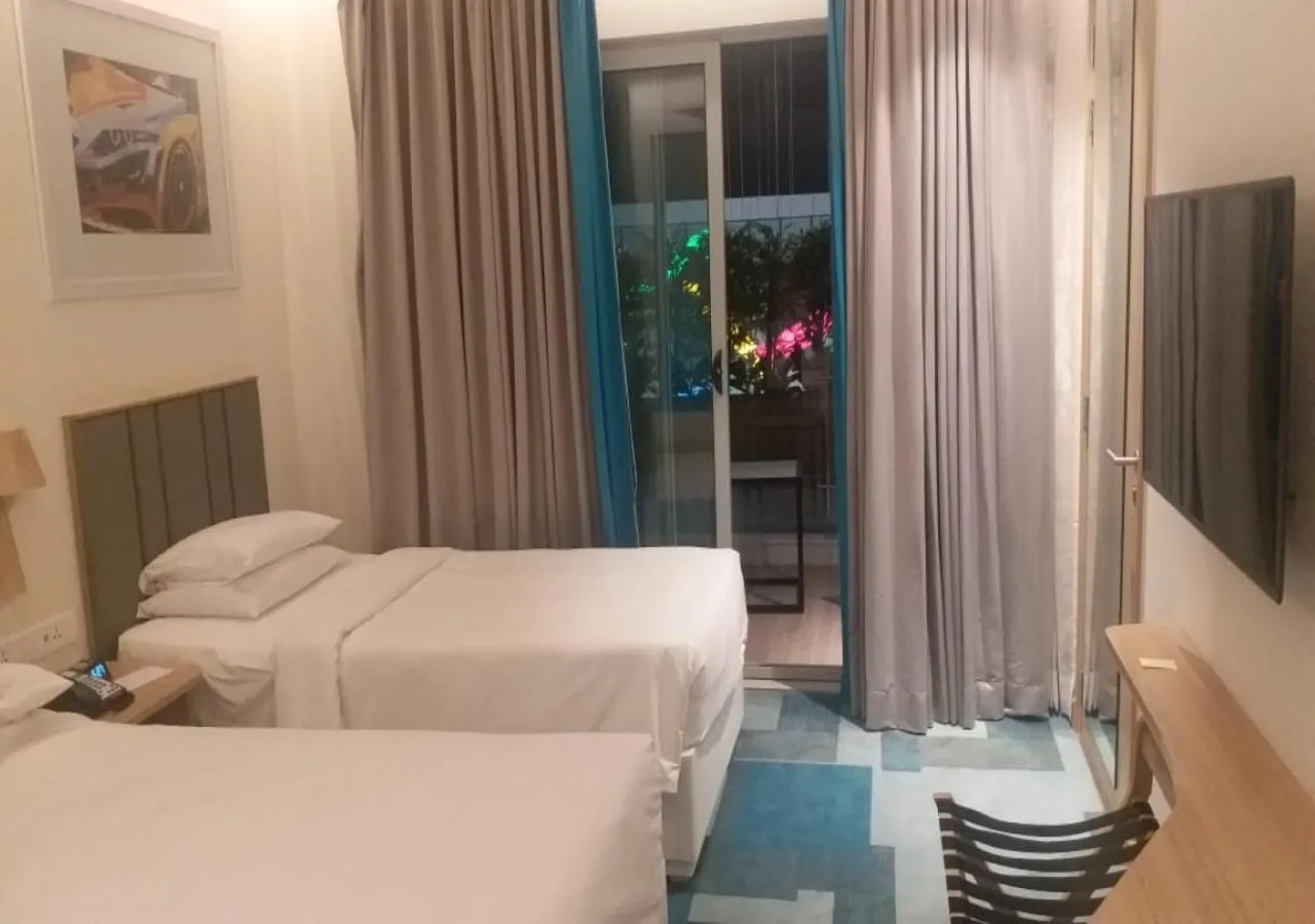 Balcony/Terrace, Bed in Holiday Inn Express & Suites Bengaluru Old Madras Road by IHG