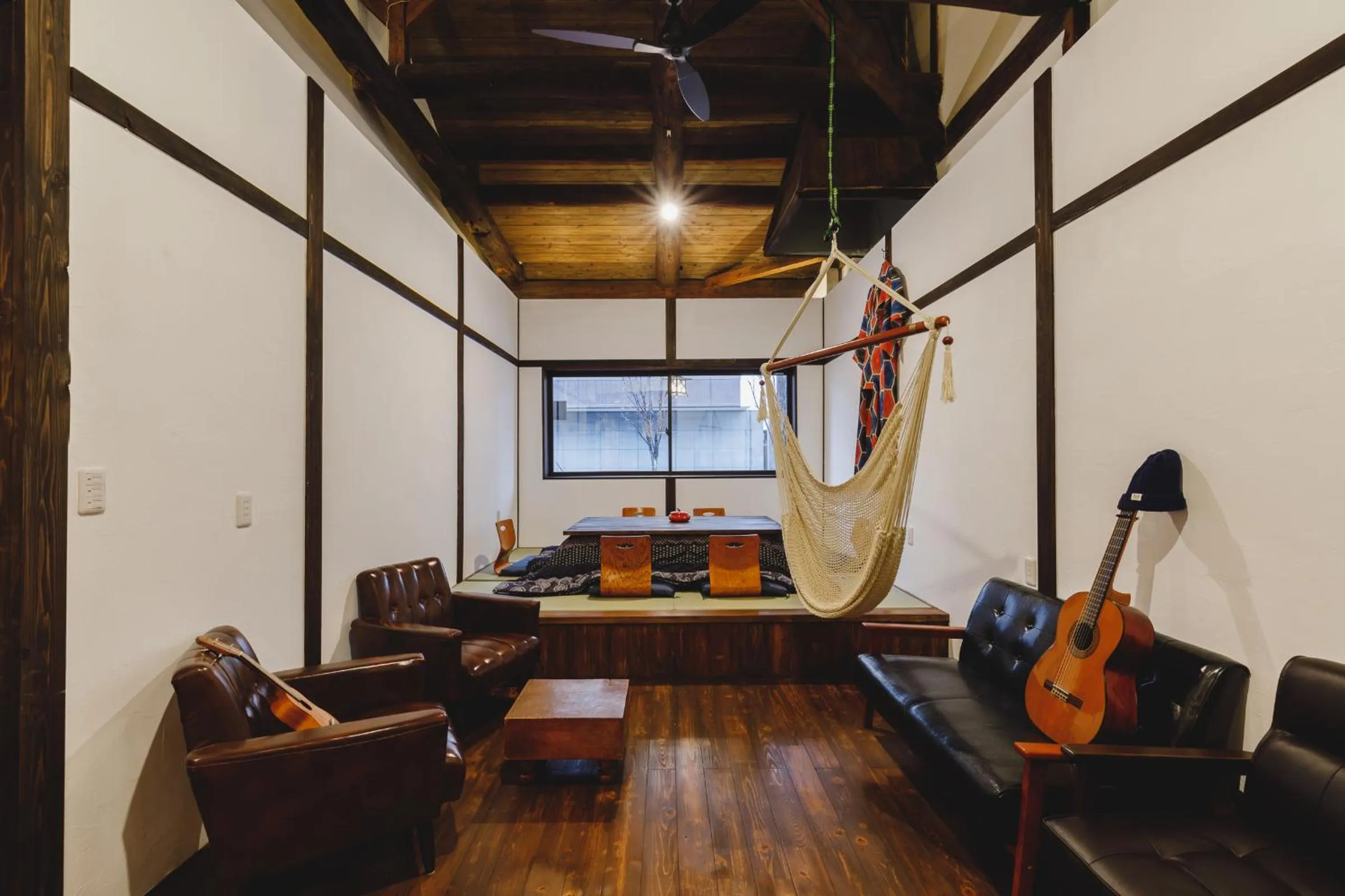 Communal lounge/ TV room in Couch Potato Hostel