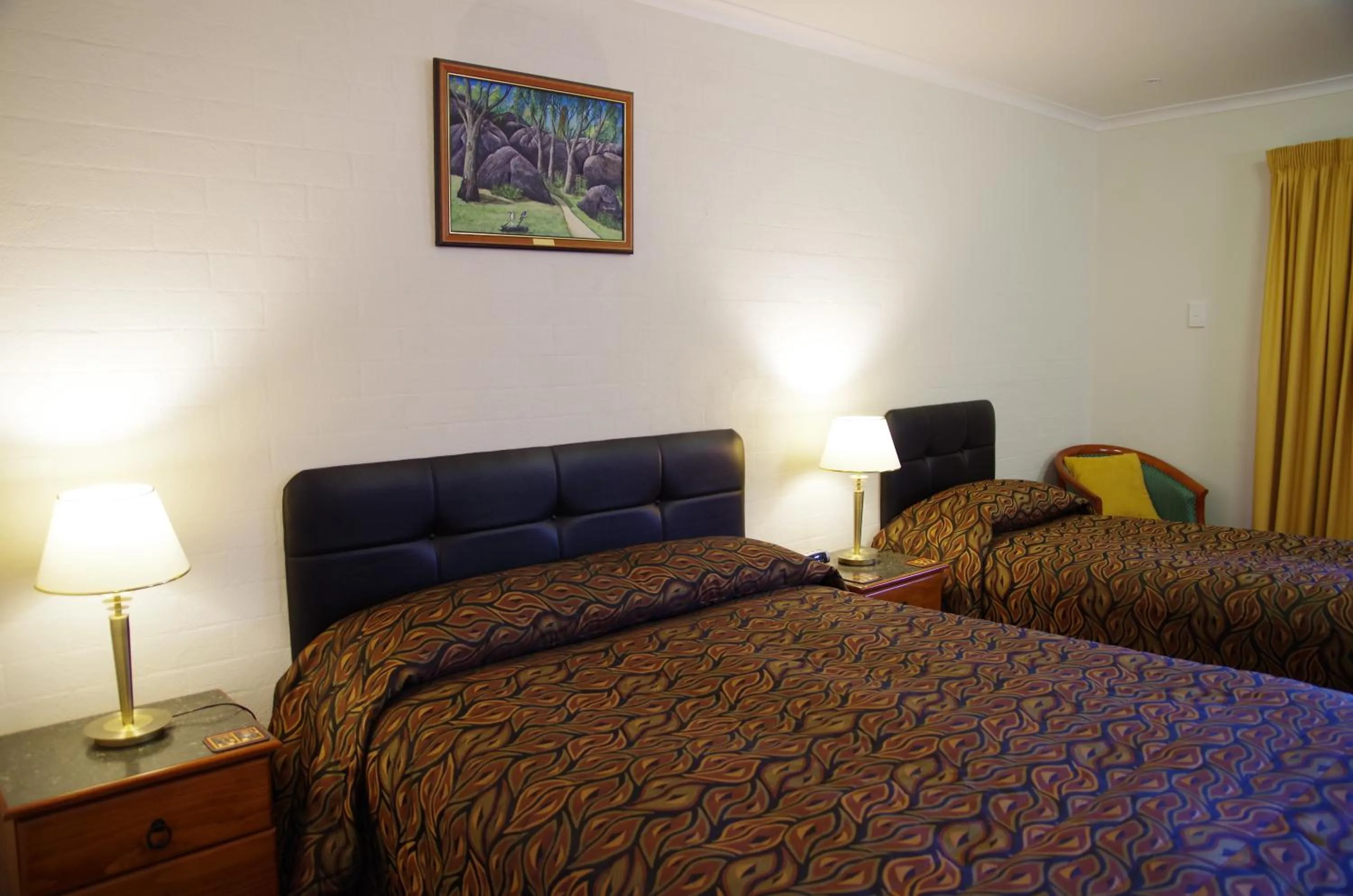 Bed in Stannum Lodge Motor Inn