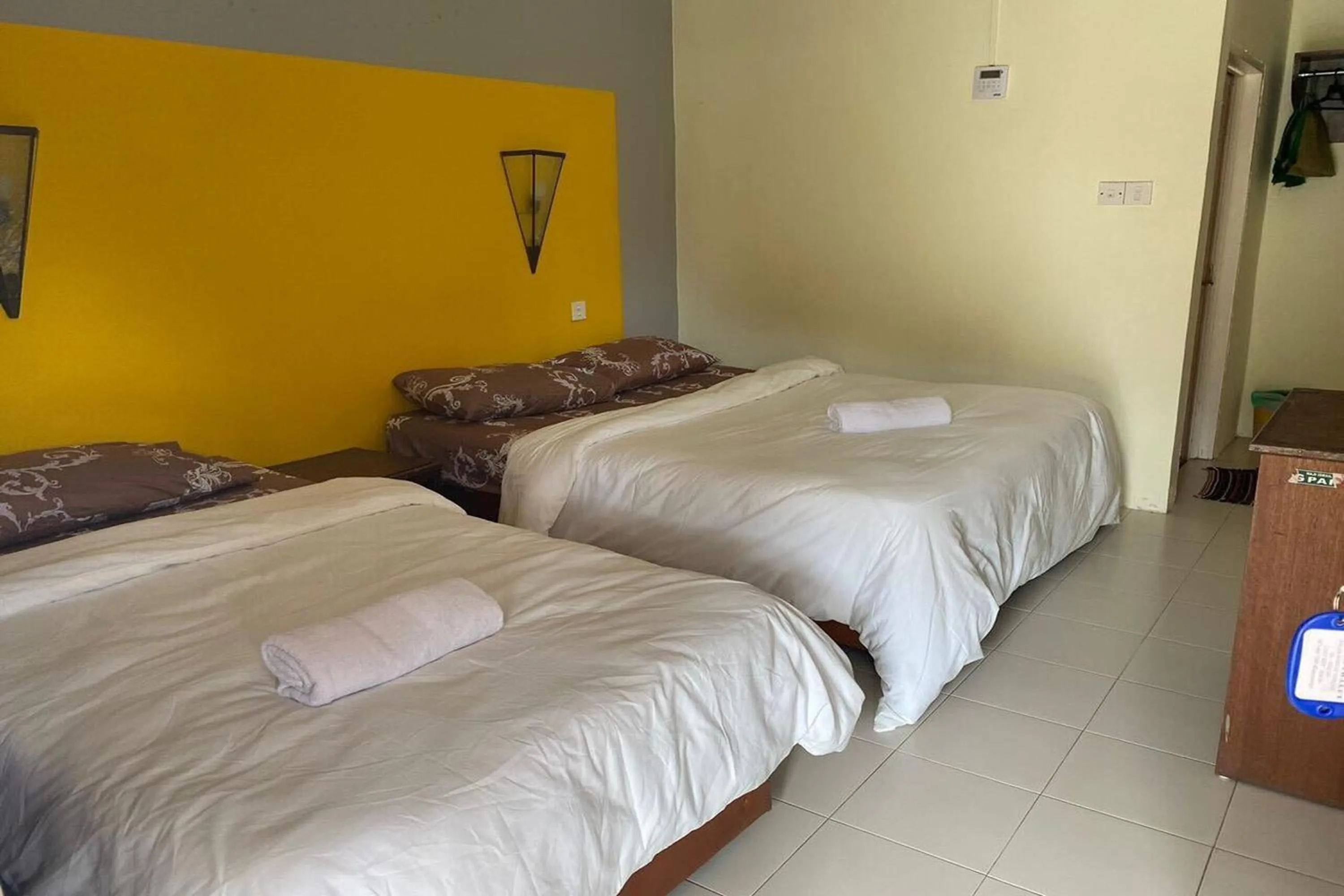 Bed in Corrie Chalet Pantai Cenang Langkawi