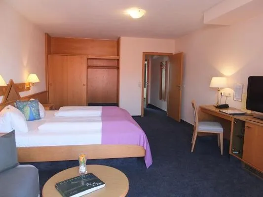 Photo of the whole room, Bed in TIPTOP Hotel Garni Pfauen