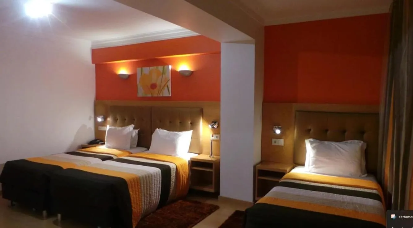 Bed in Dom João Glamour Hotel