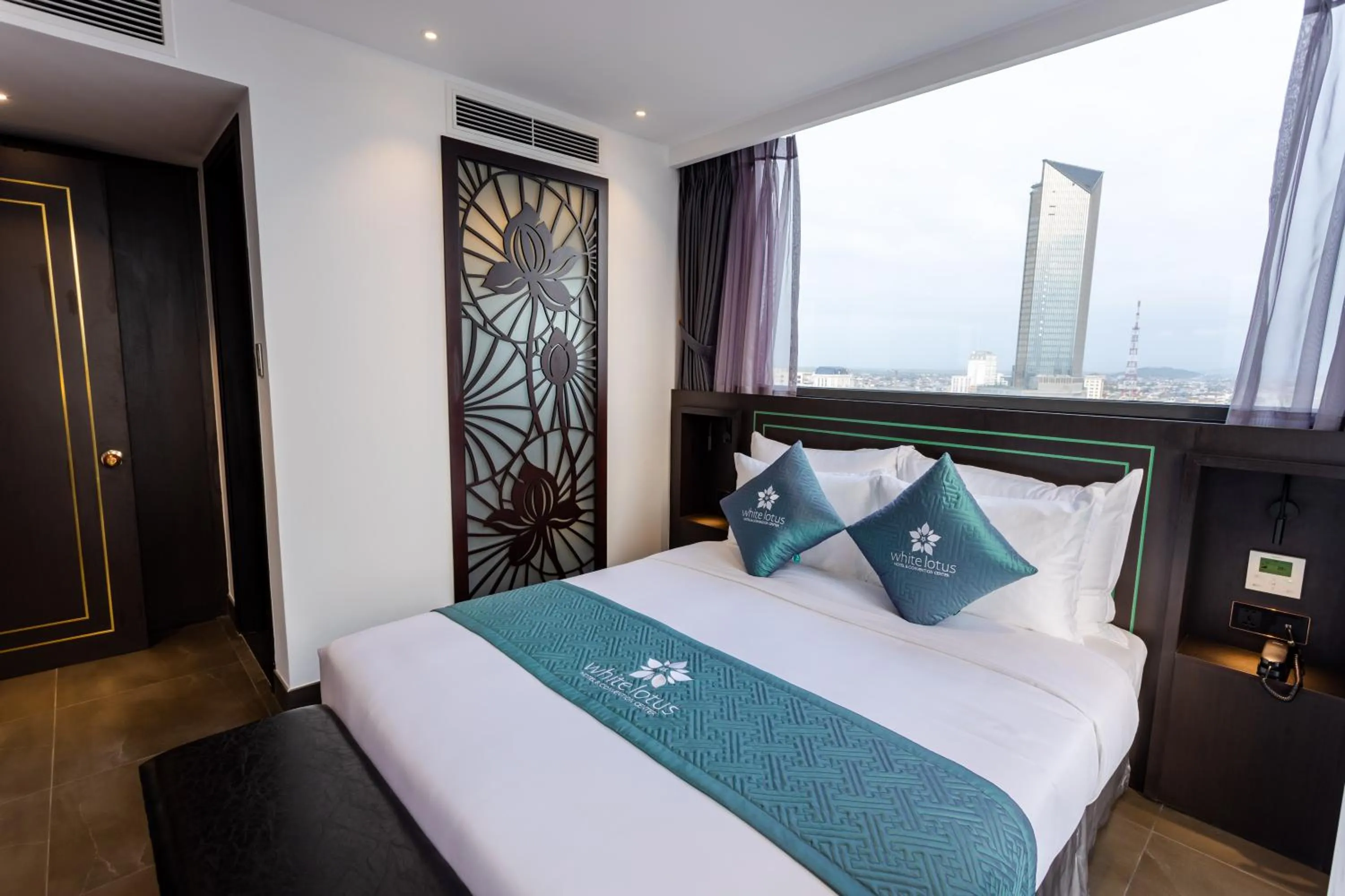 Photo of the whole room, Bed in White Lotus Hue Hotel