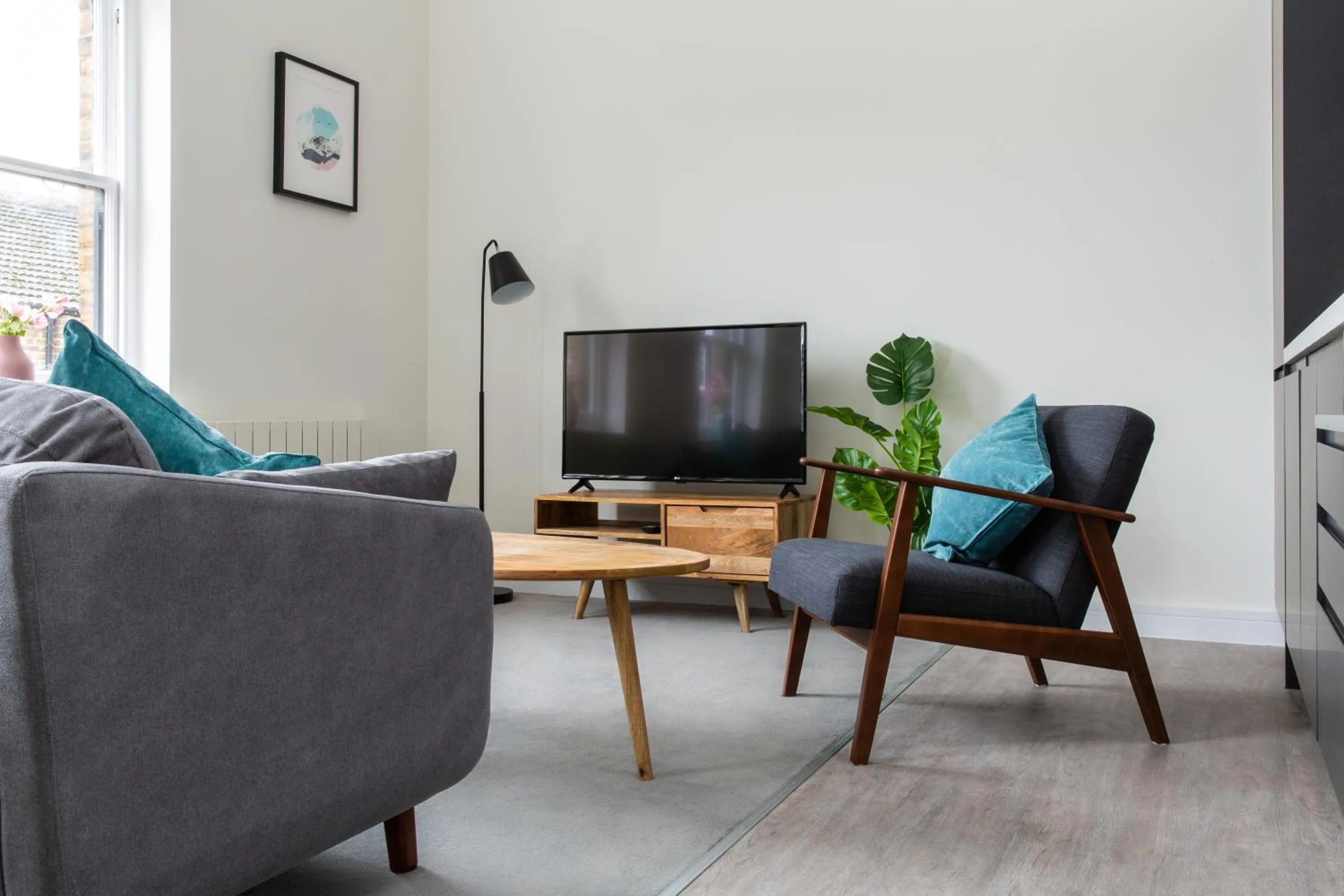 Living room in Queens Park by Viridian Apartments