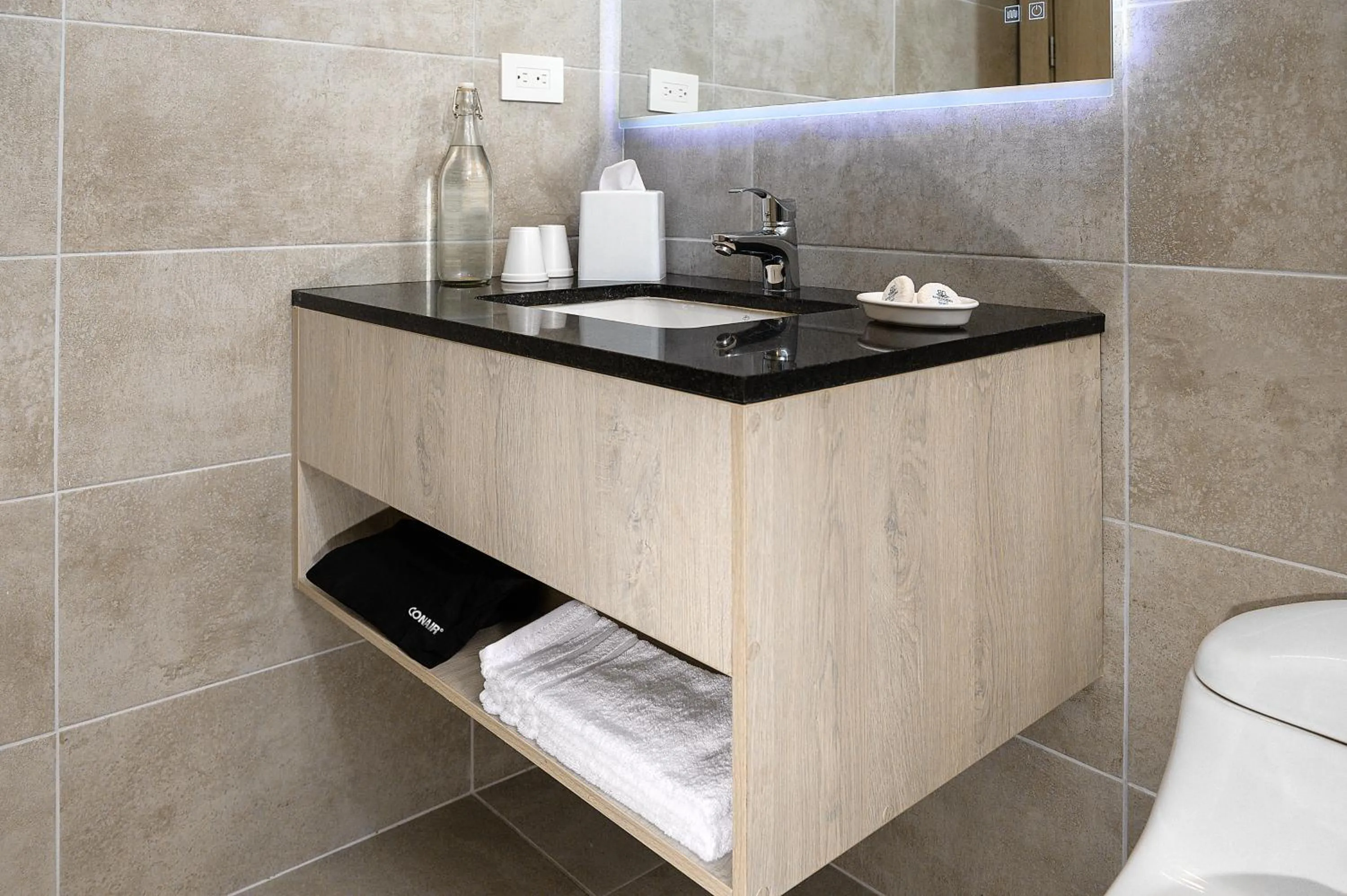 Bathroom in River Garden Hotel + Suites