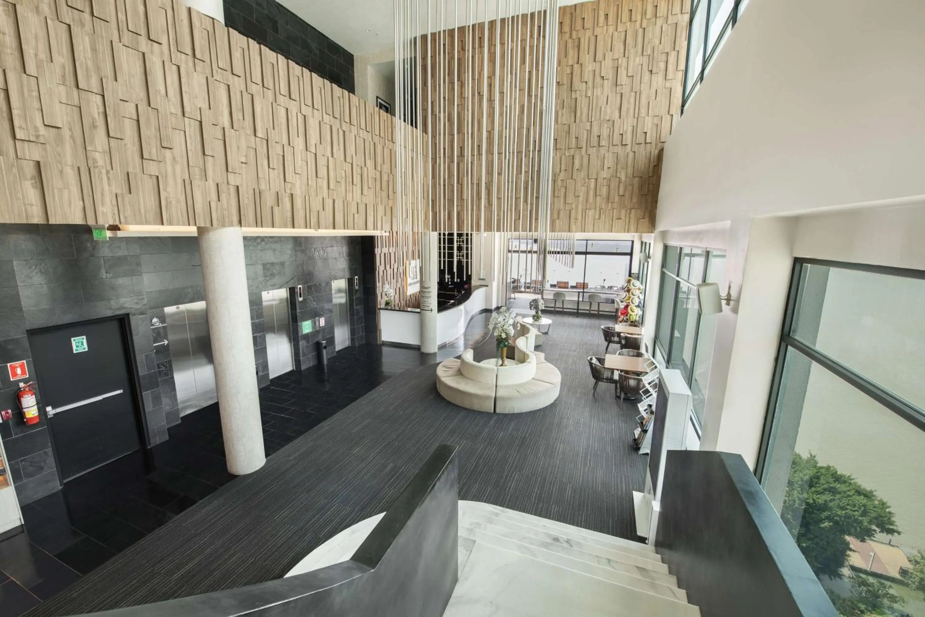 Lobby or reception in River Garden Hotel + Suites