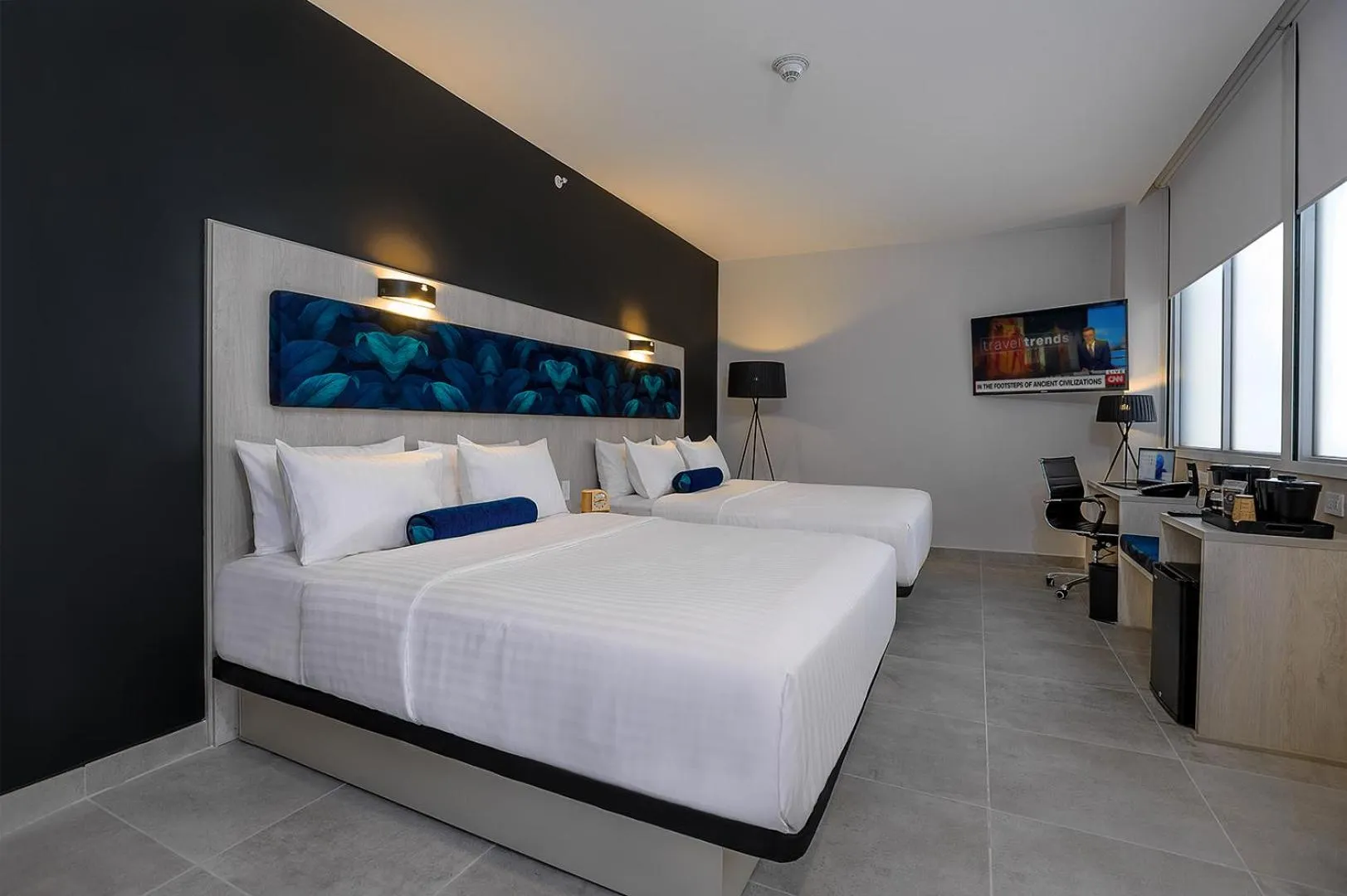 Bed in River Garden Hotel + Suites