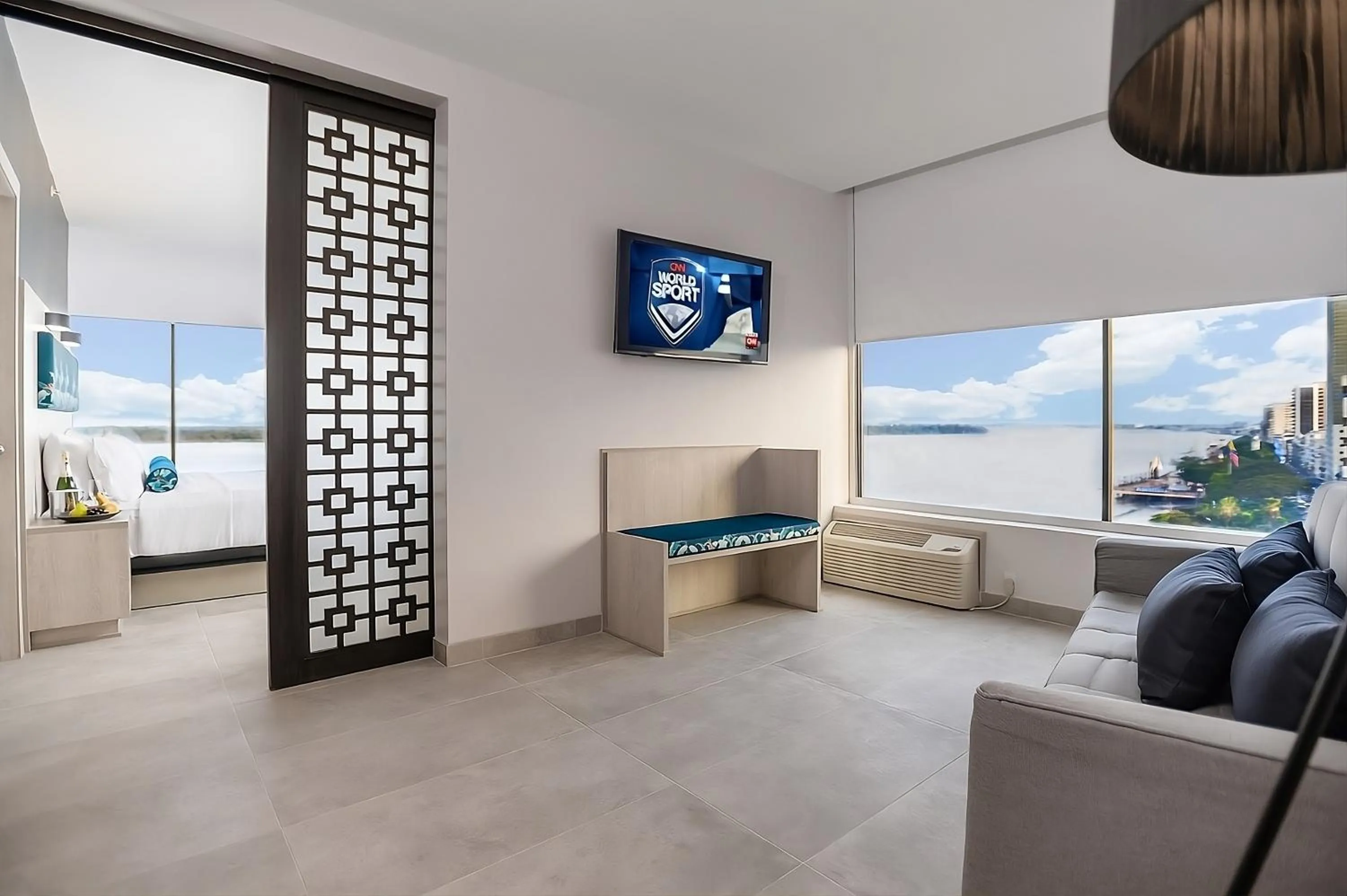 Communal lounge/ TV room in River Garden Hotel + Suites