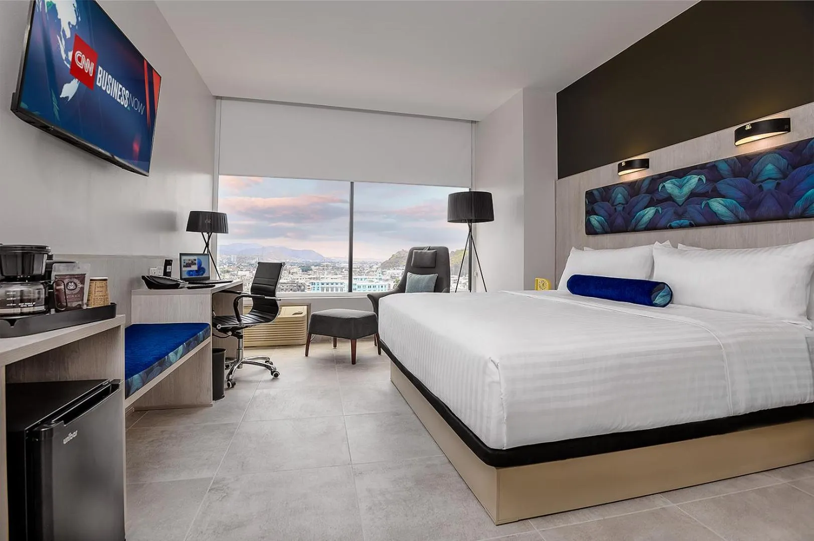 Bed in River Garden Hotel + Suites