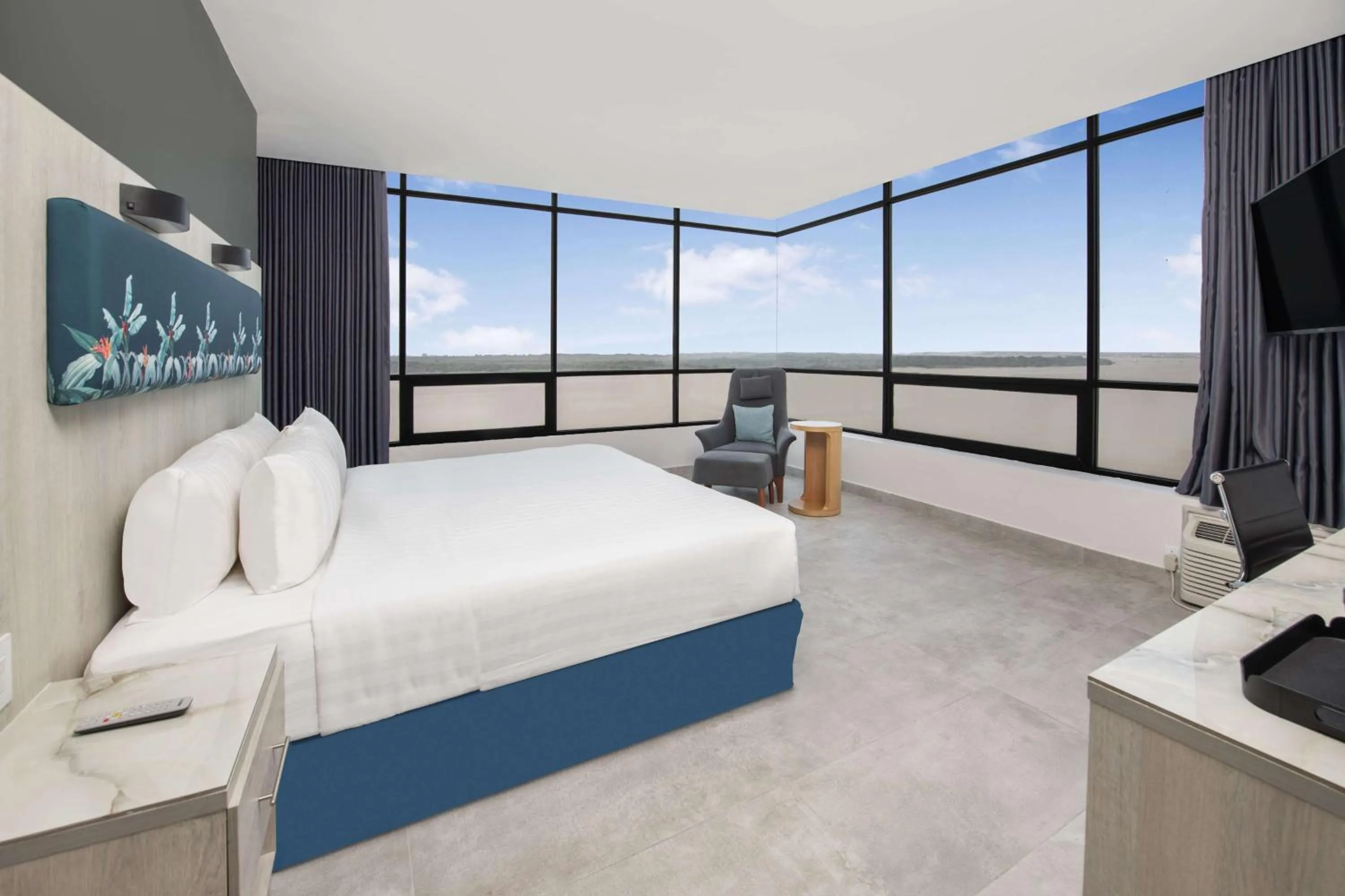 Bed in River Garden Hotel + Suites