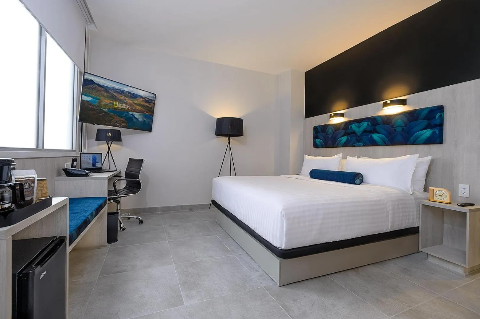 Bed in River Garden Hotel + Suites