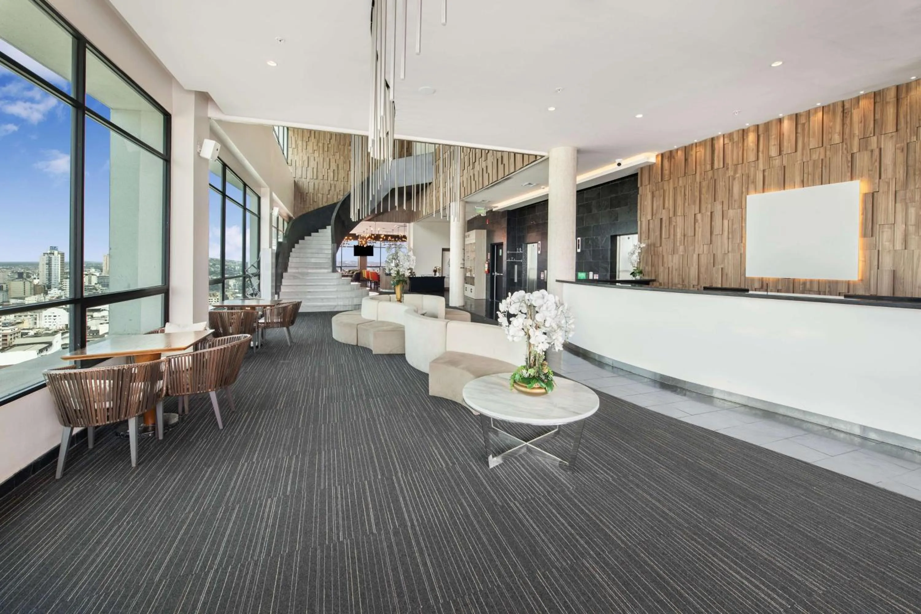 Lobby or reception in River Garden Hotel + Suites