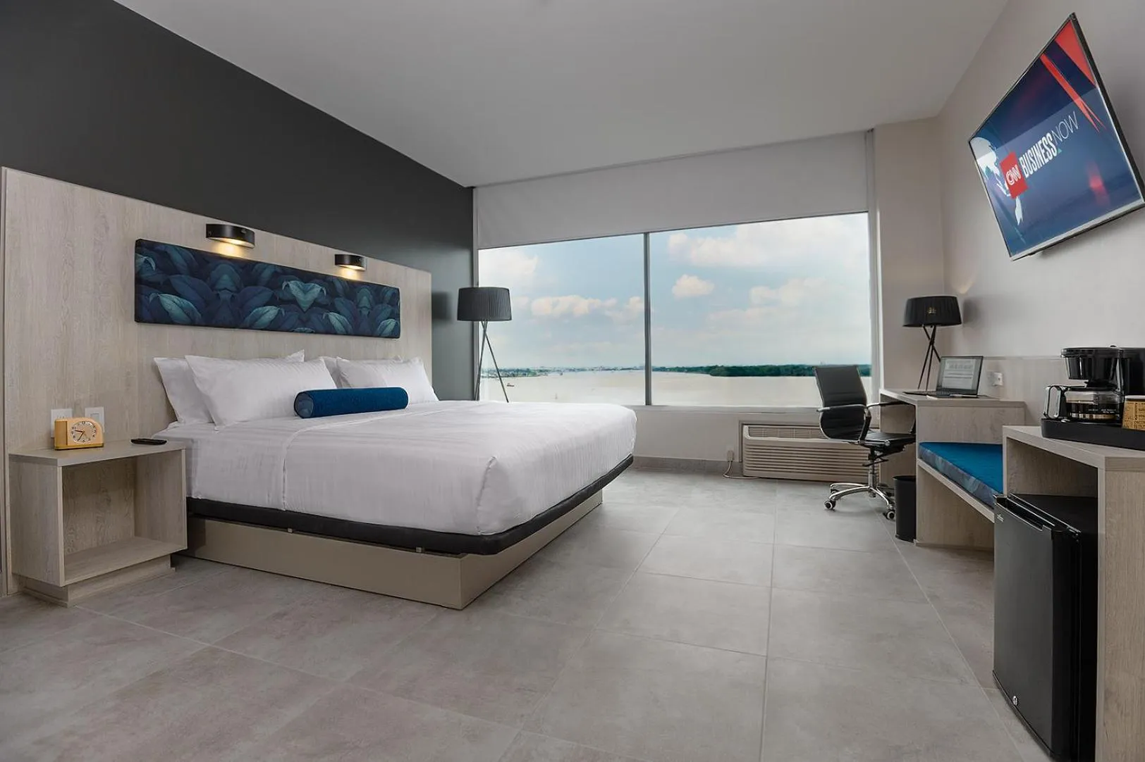 Bed in River Garden Hotel + Suites