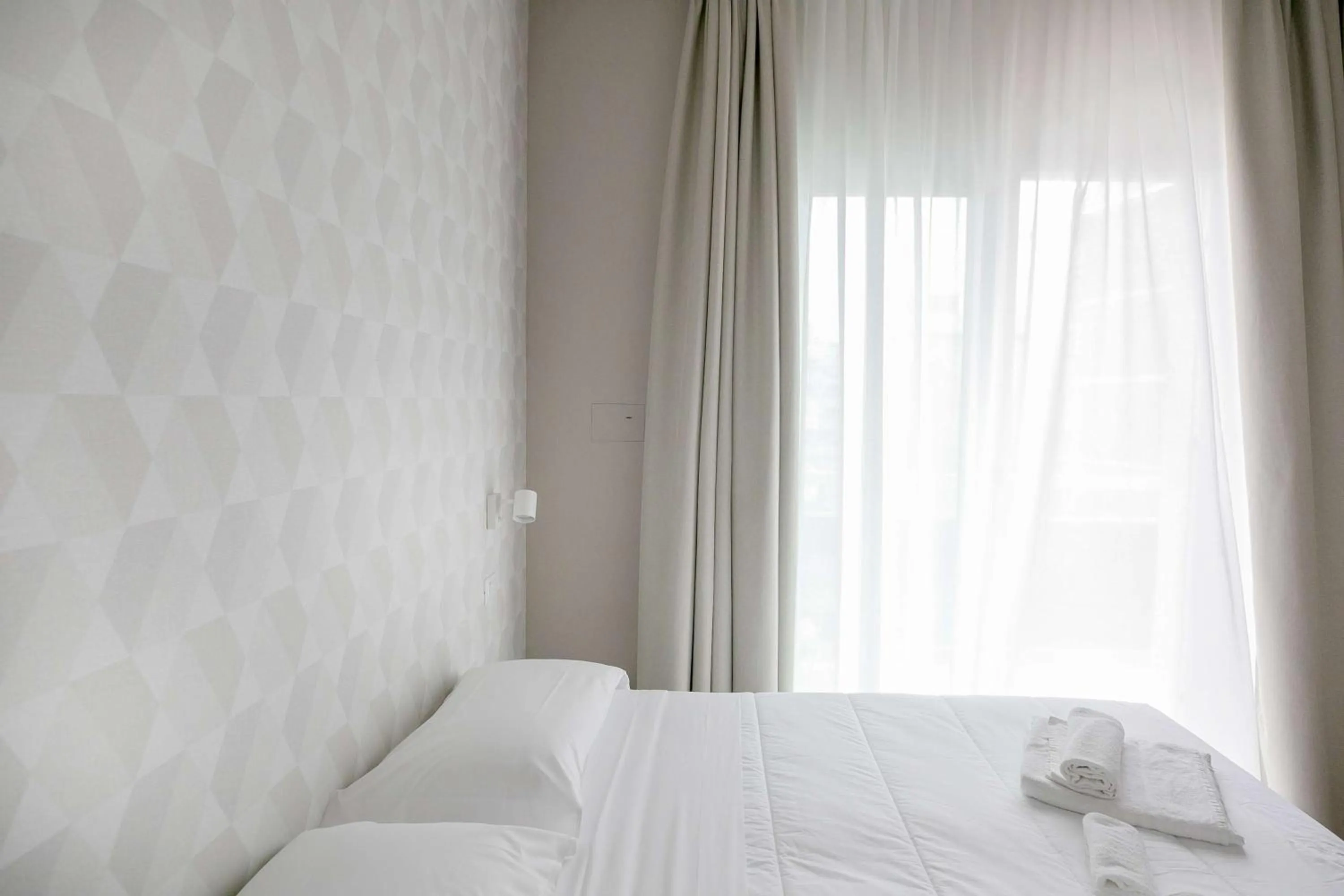 Bed in Hotel Benvenuto