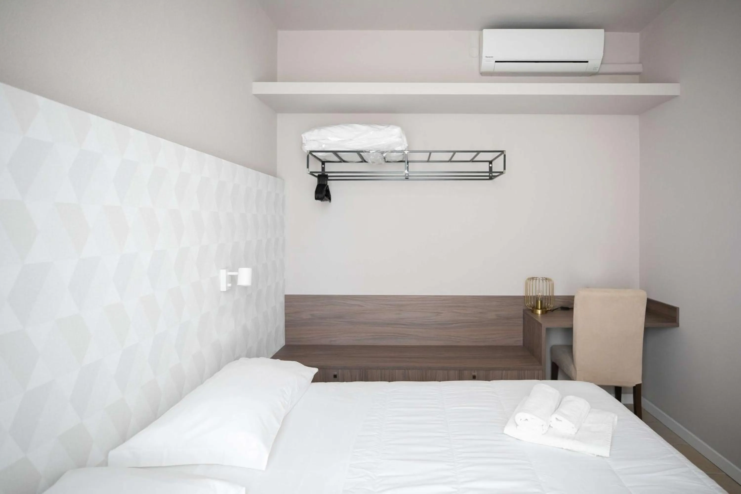 Bed in Hotel Benvenuto