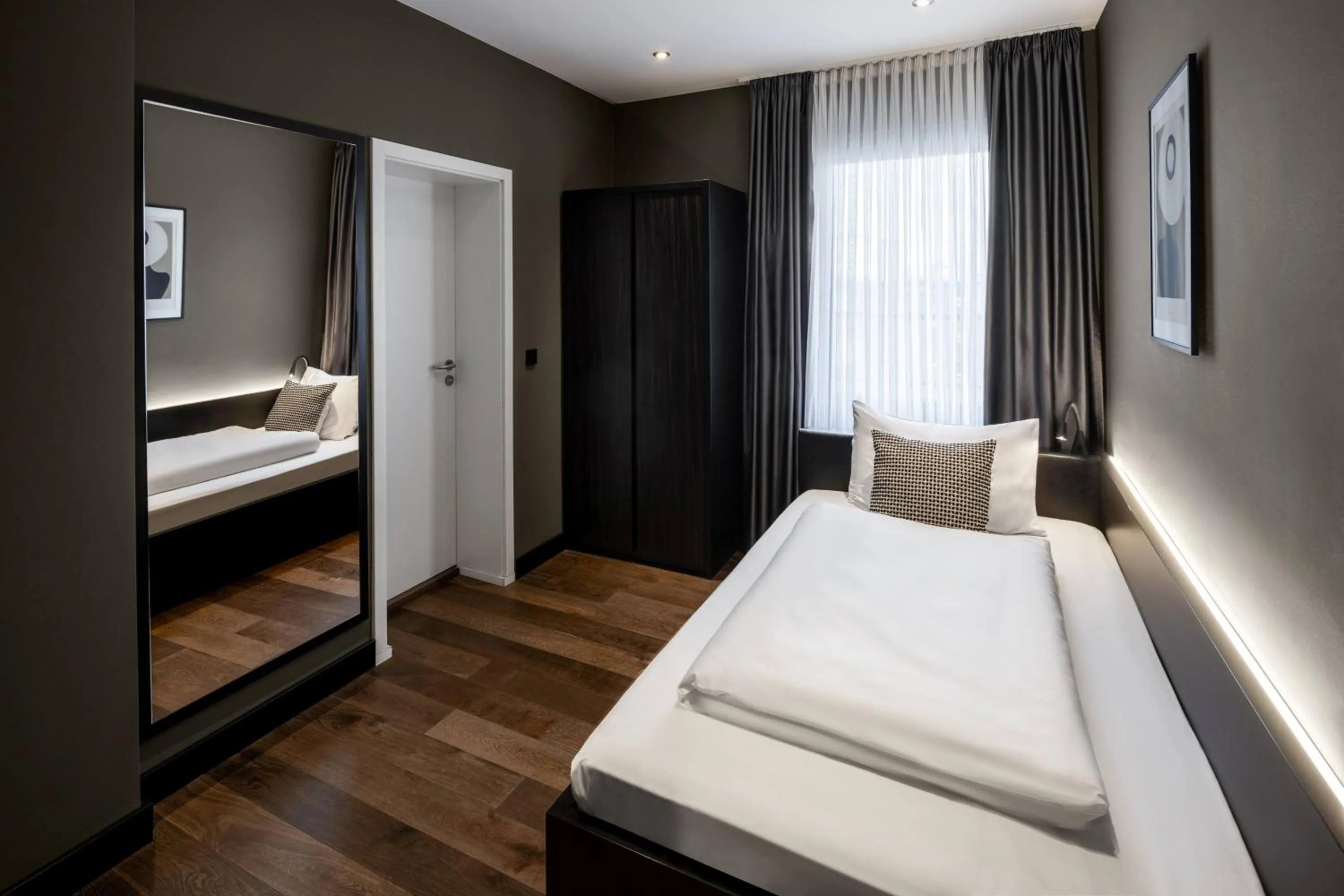 Bed in Hotel AMANO Düsseldorf