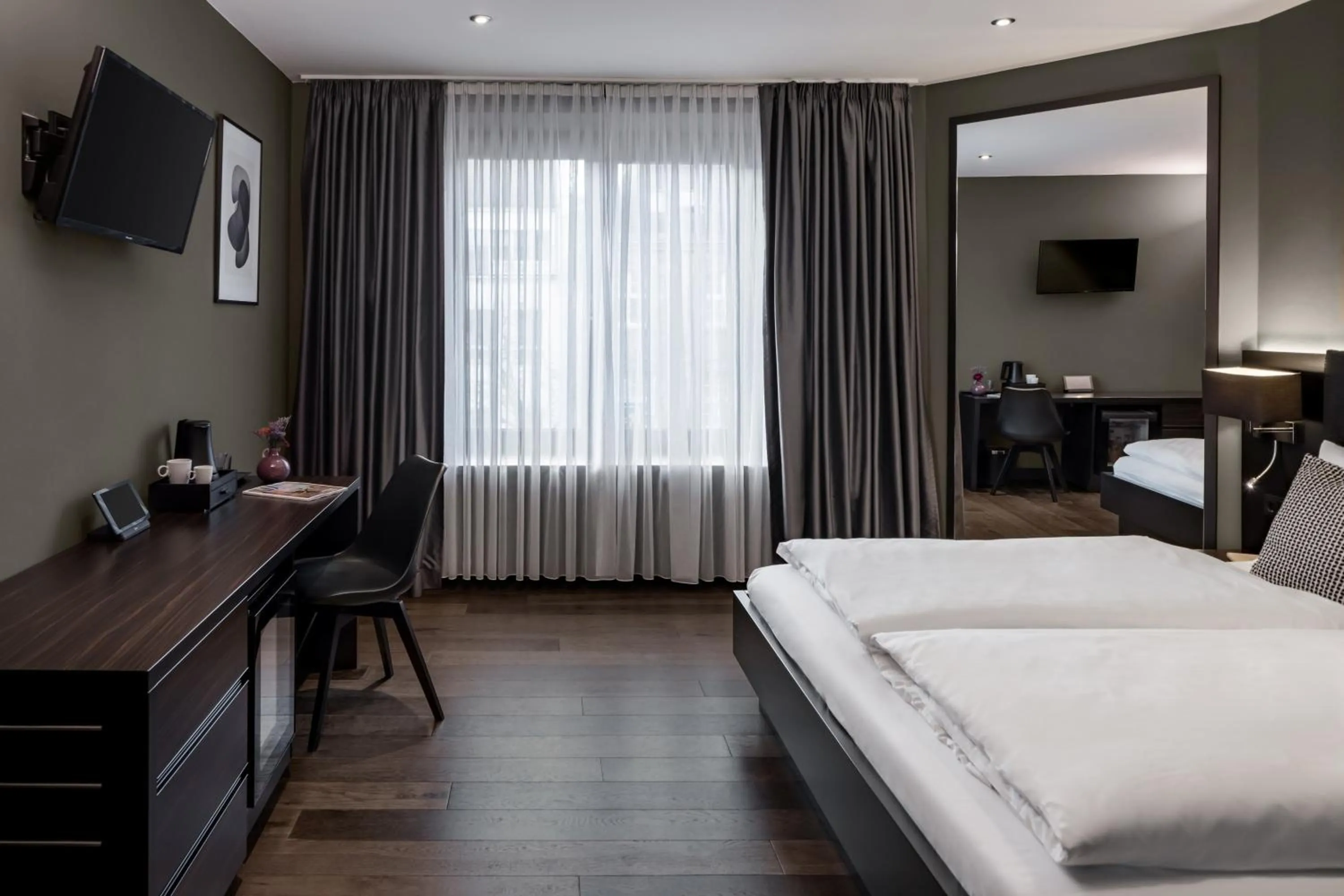 Bed in Hotel AMANO Düsseldorf