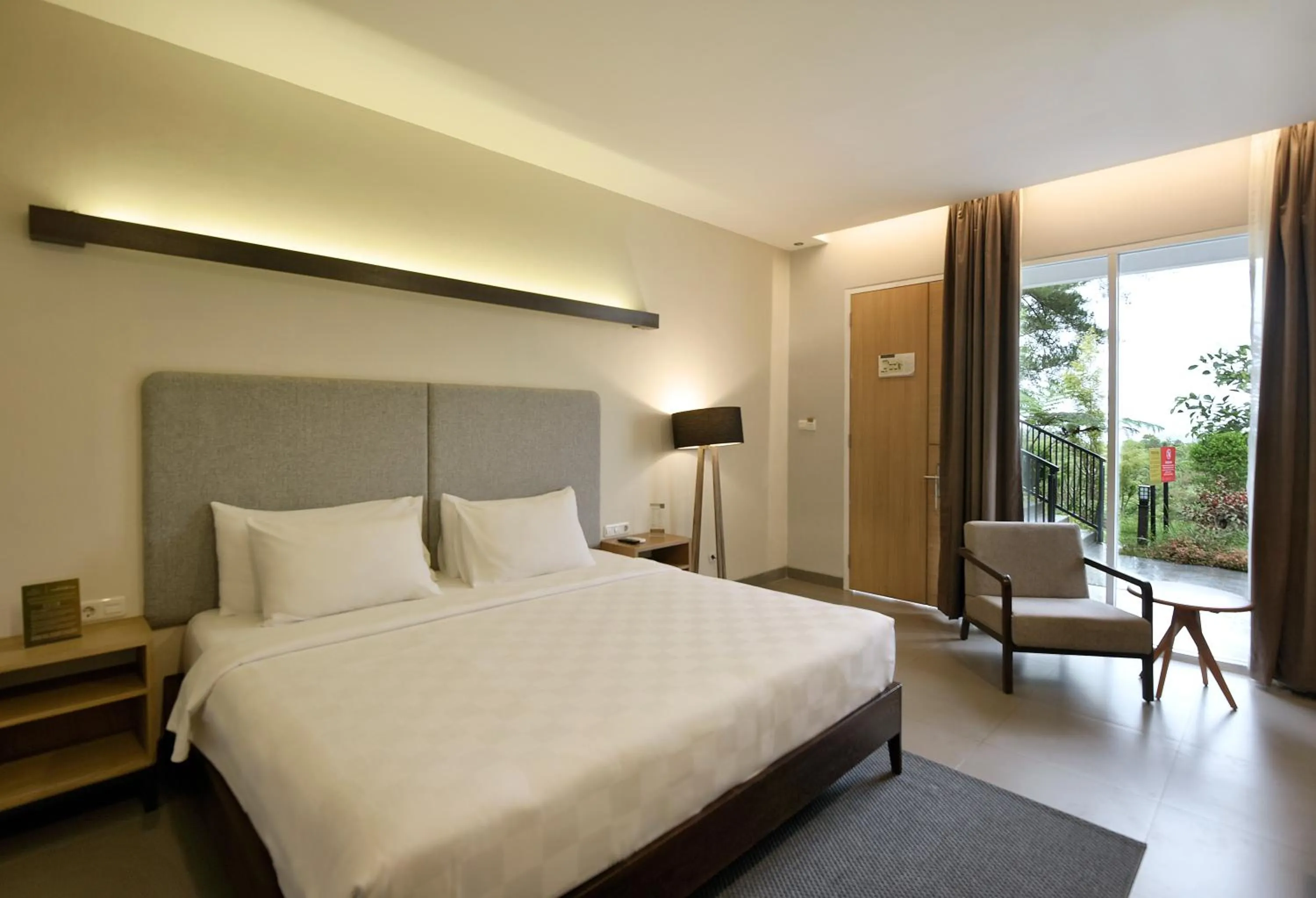 Bed in The Balcone Suites & Resort