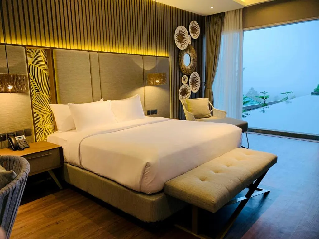 Bed in The Balcone Suites & Resort