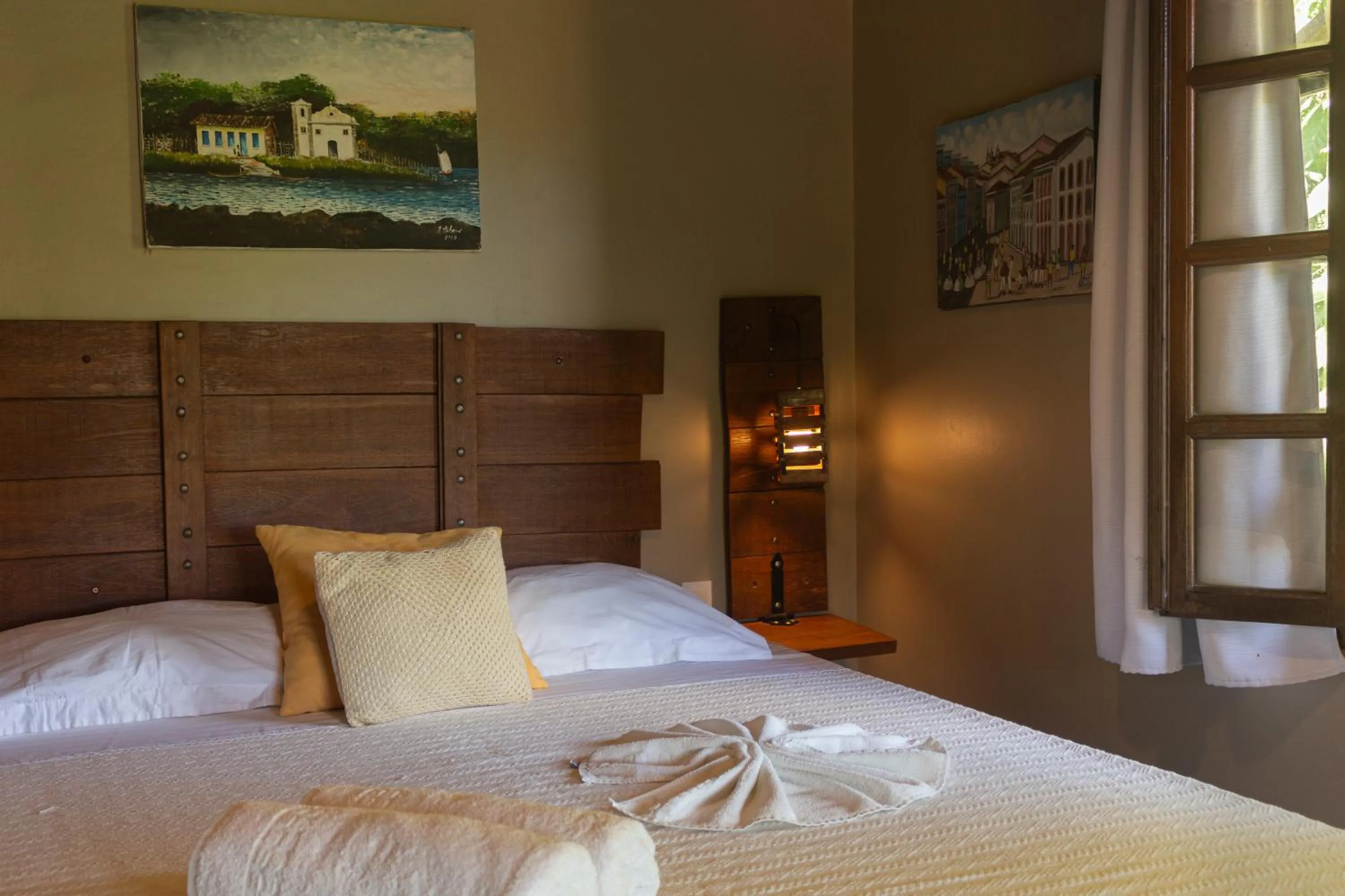 Bed in Pousada Aquarela