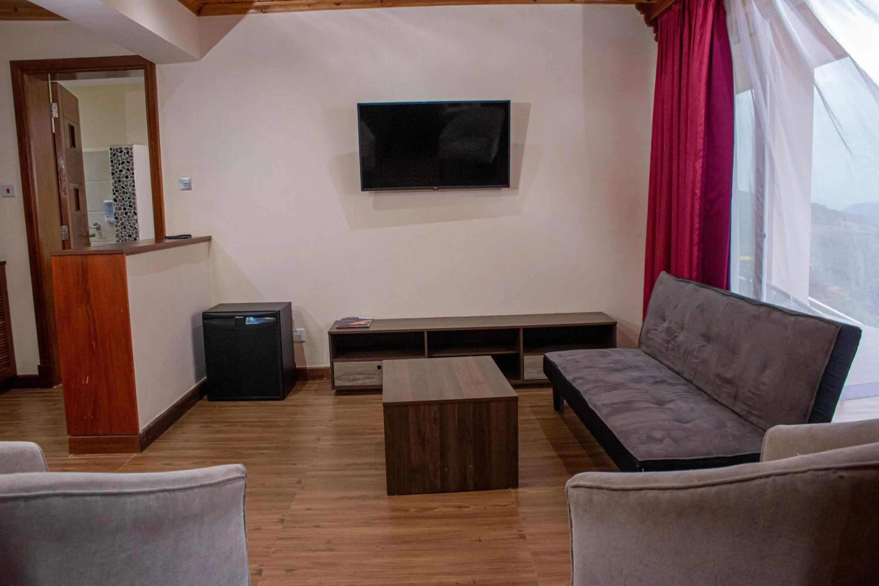 Communal lounge/ TV room in Lake Elementaita Mountain Lodge