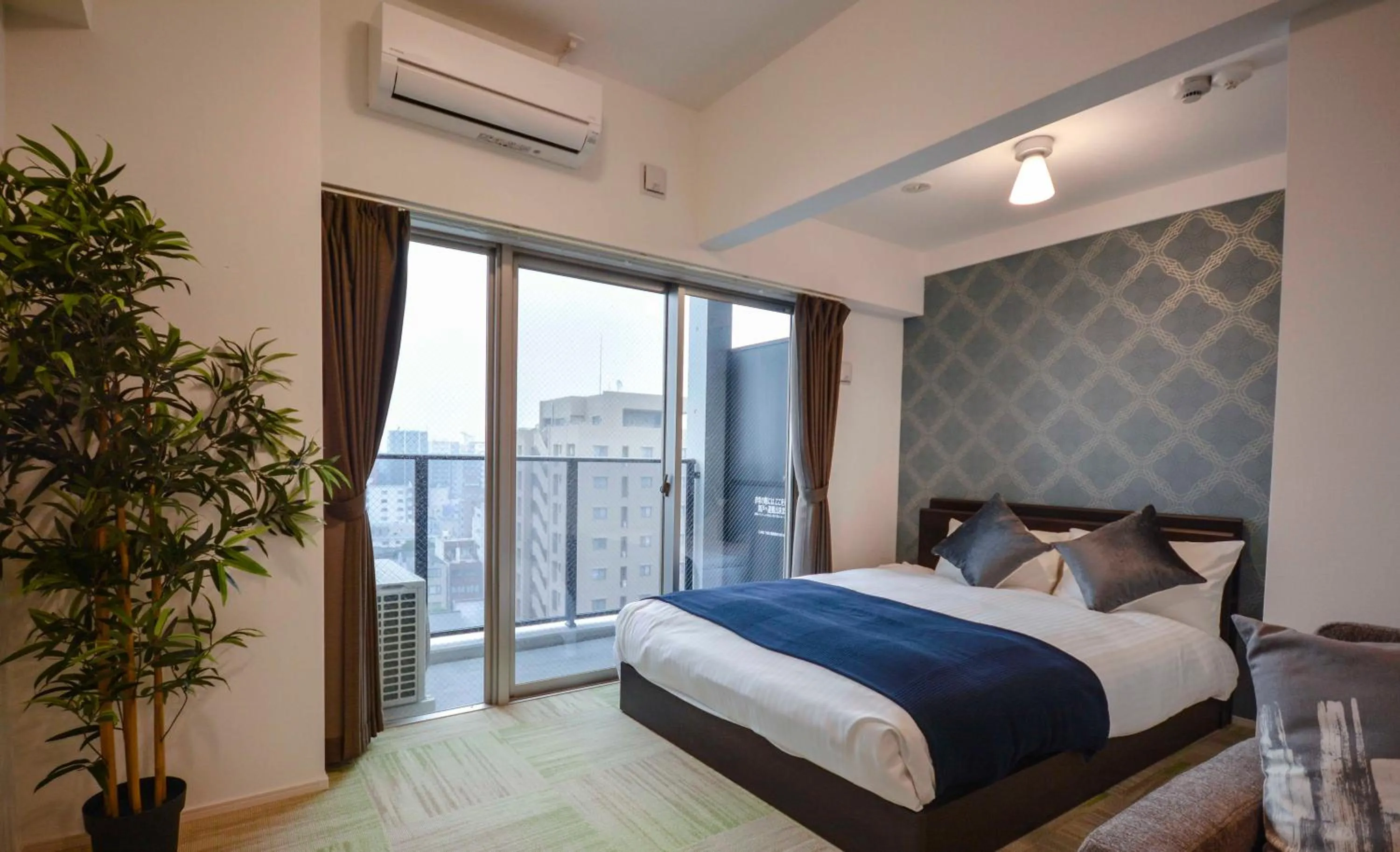 Bed in The Grand Residence Hotel Tenjin