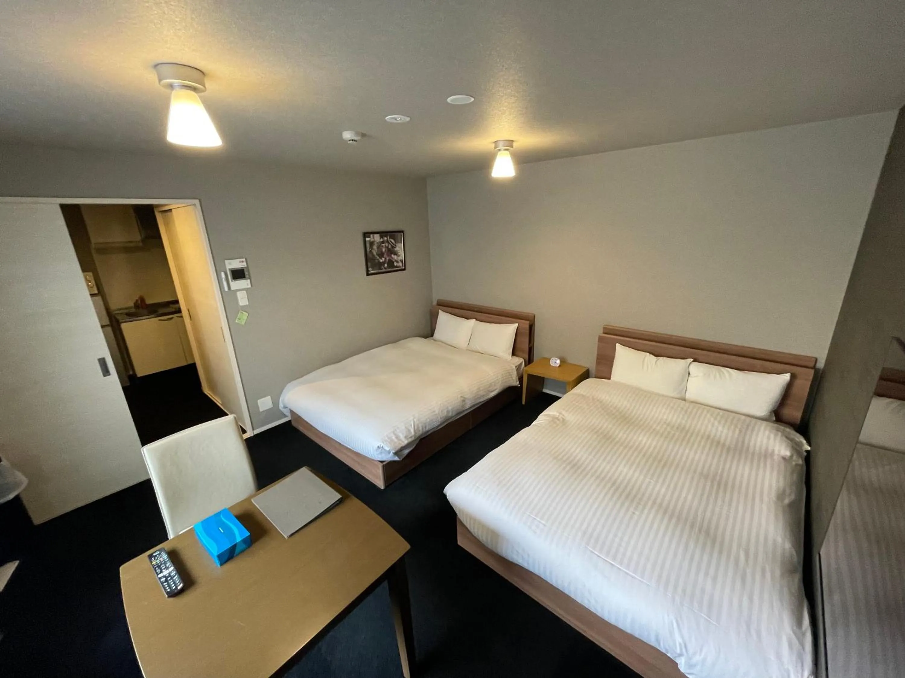 Bed in The Grand Residence Hotel Tenjin