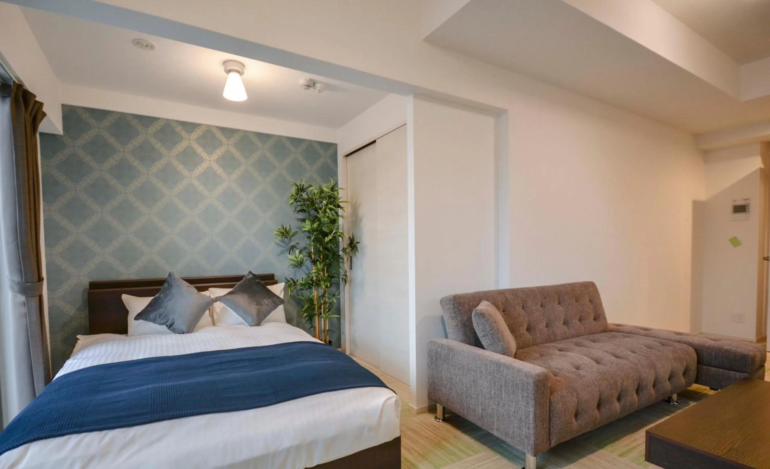 Photo of the whole room, Bed in The Grand Residence Hotel Tenjin