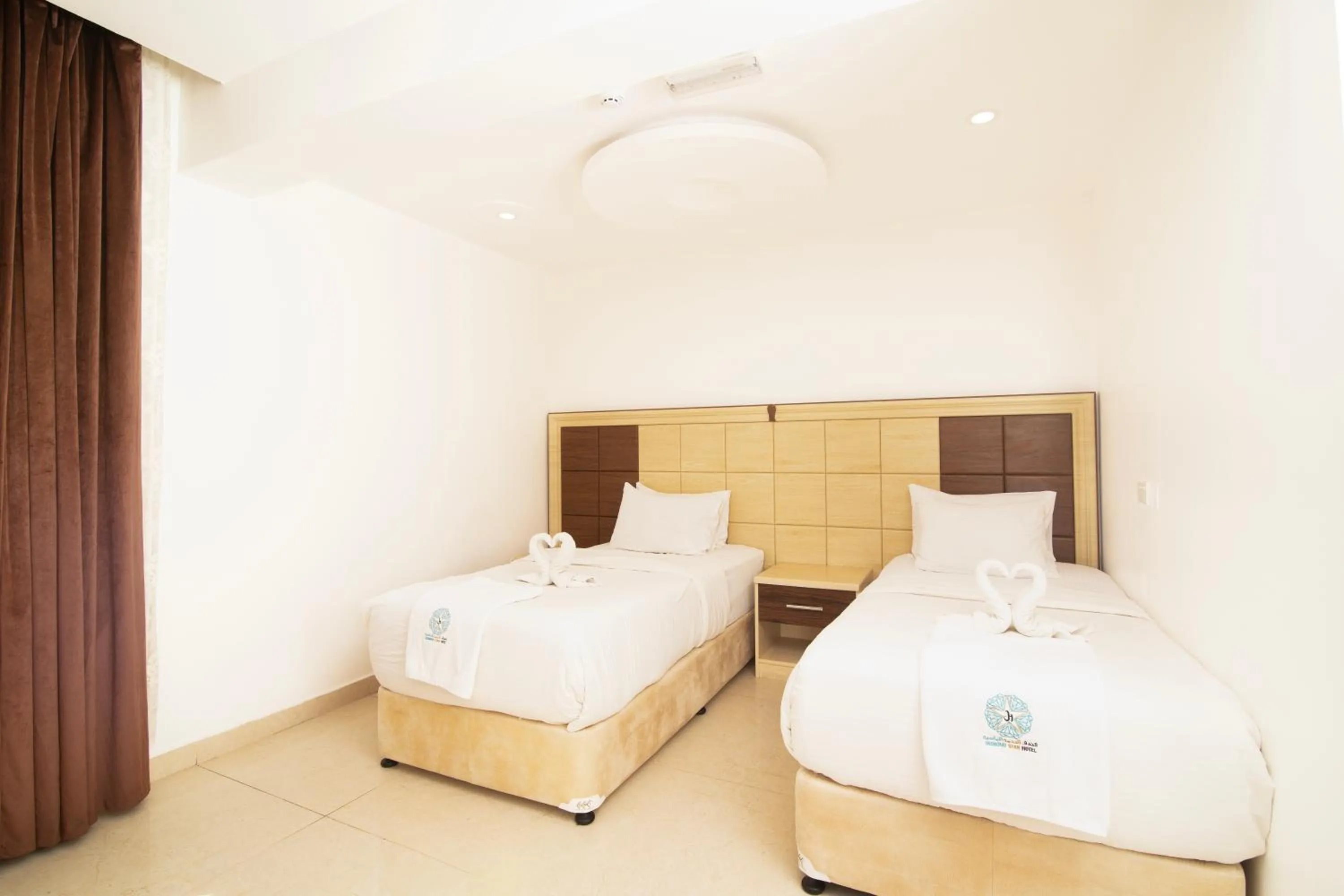 Bed in Diamond Star Hotel فندق النجمة الماسية
