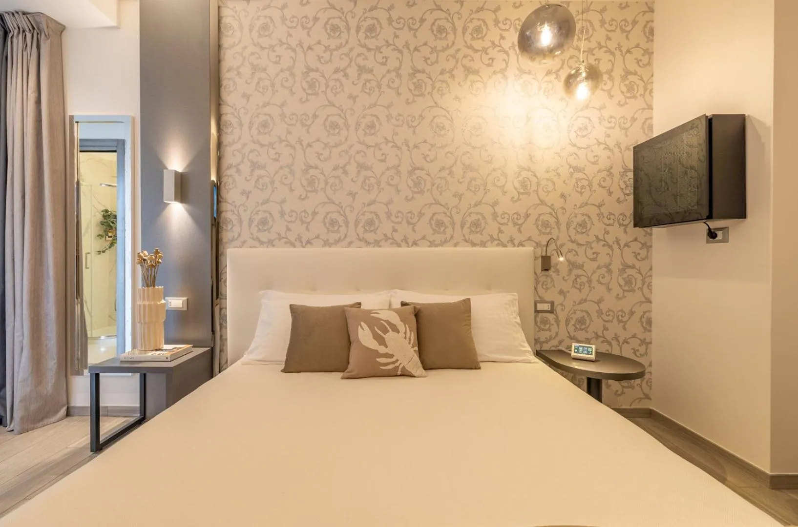 Bed in Romagna Suite Hotel