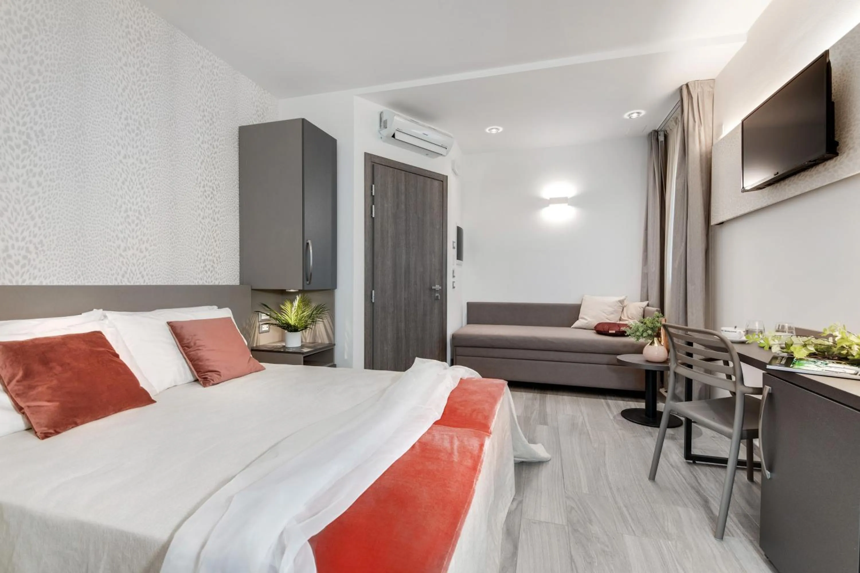 Bed in Romagna Suite Hotel