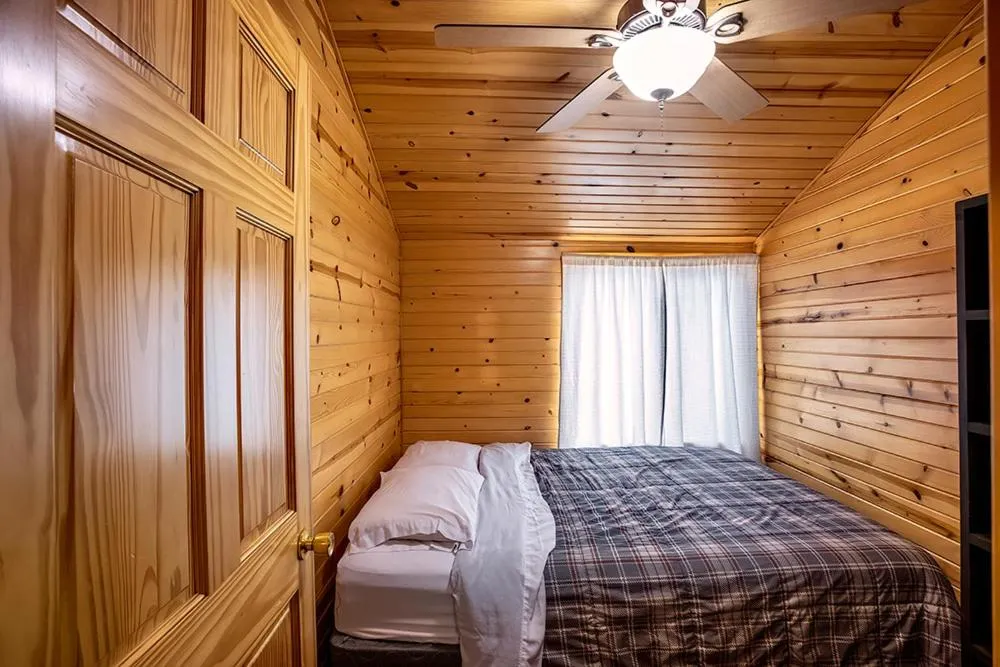 Bed in Big River Escape Riverside Cabins