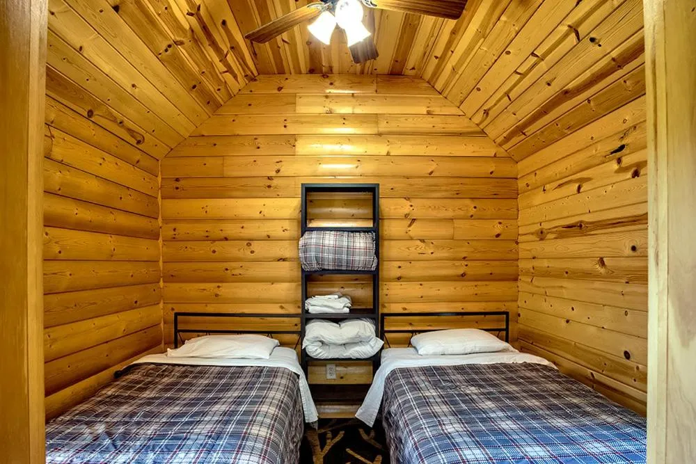 Bed in Big River Escape Riverside Cabins