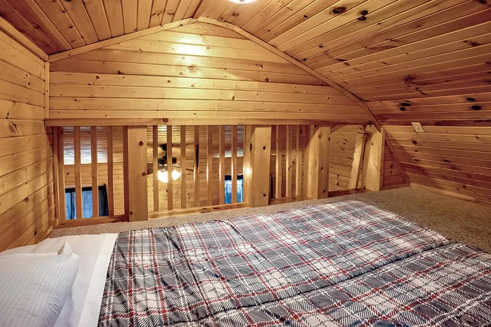 Bed in Big River Escape Riverside Cabins