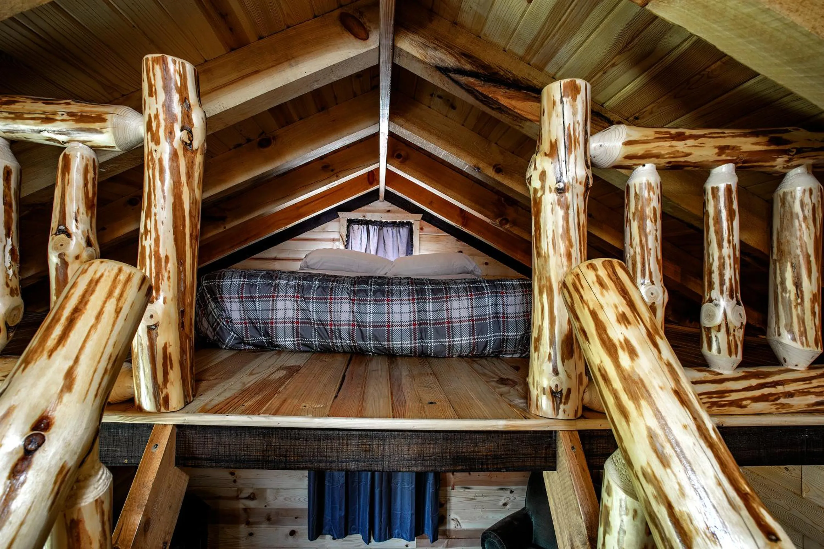 Bed in Big River Escape Riverside Cabins