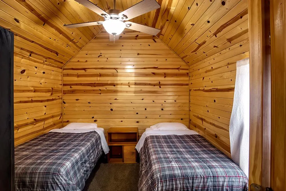 Bed in Big River Escape Riverside Cabins