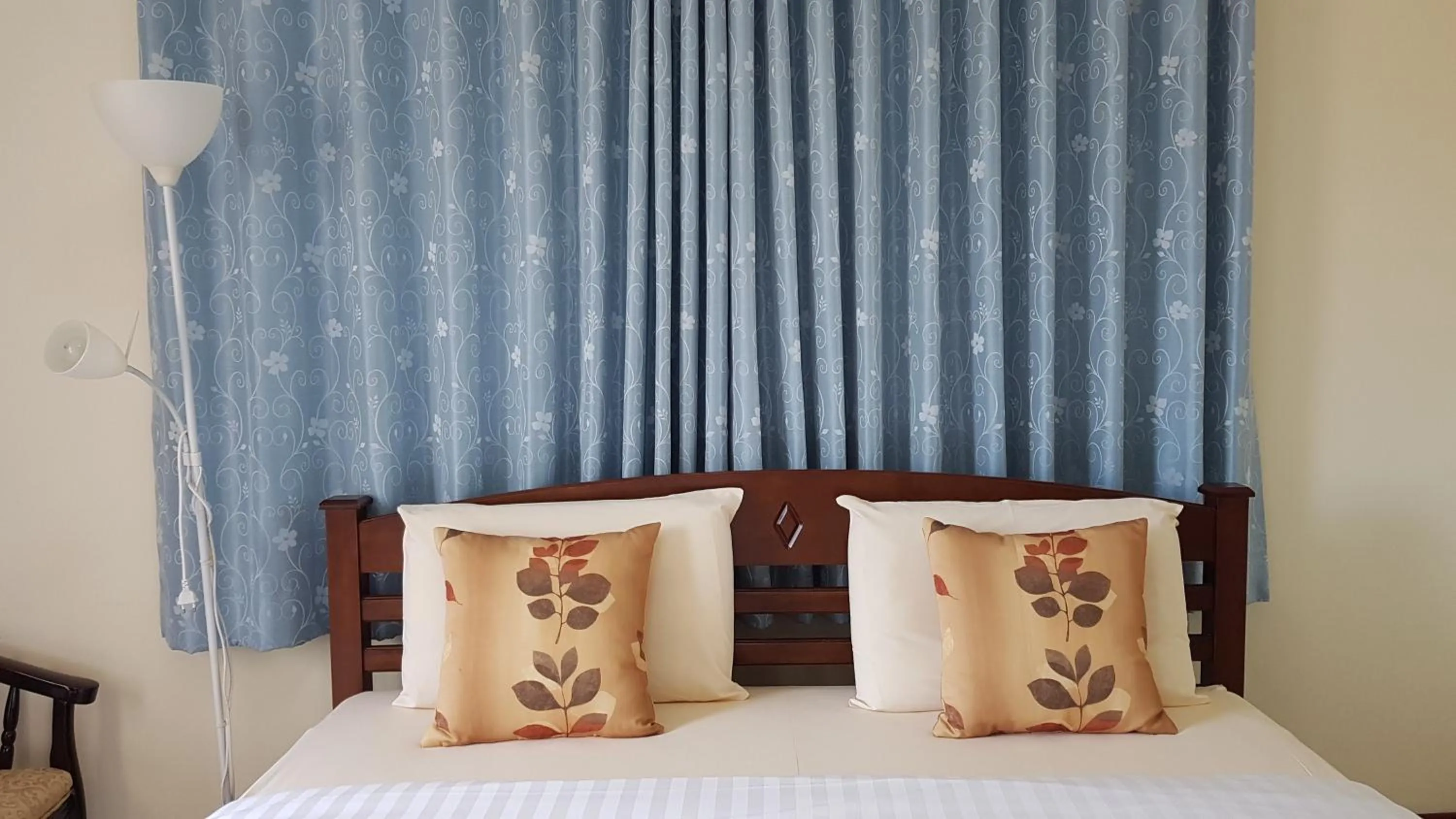 Bed in Baan Taweesuk Guest House