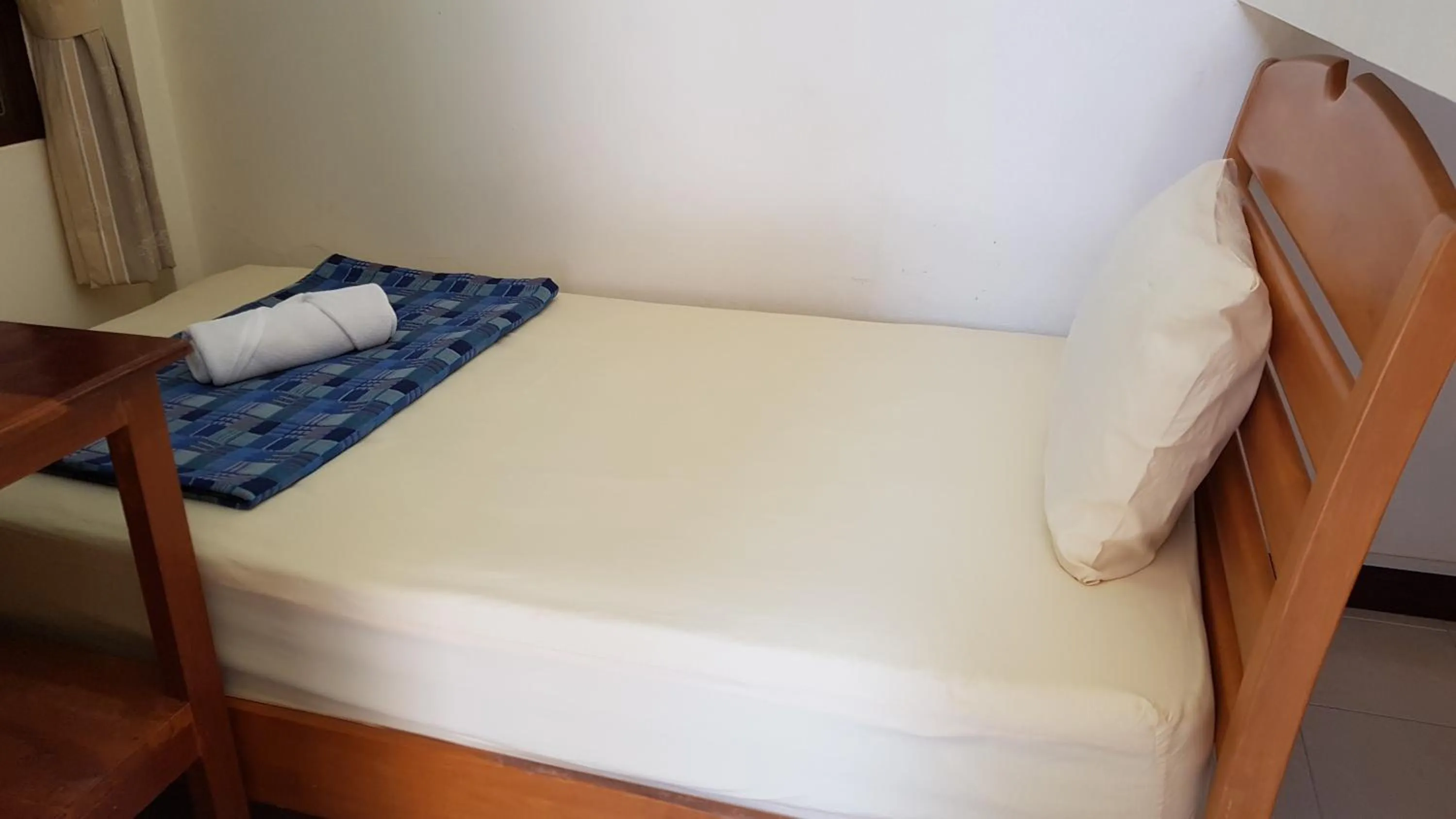 Bed in Baan Taweesuk Guest House