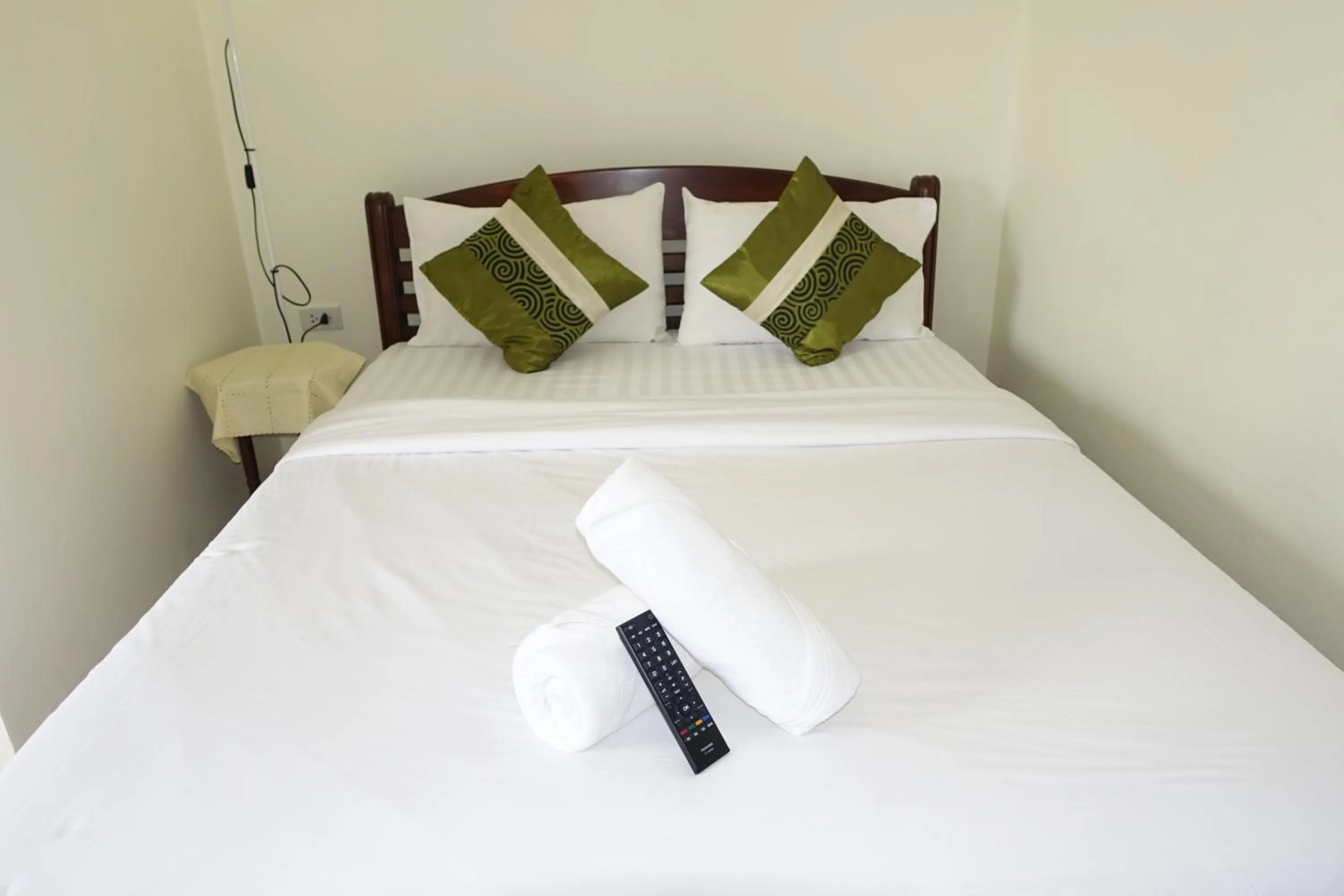 Bed in Baan Taweesuk Guest House