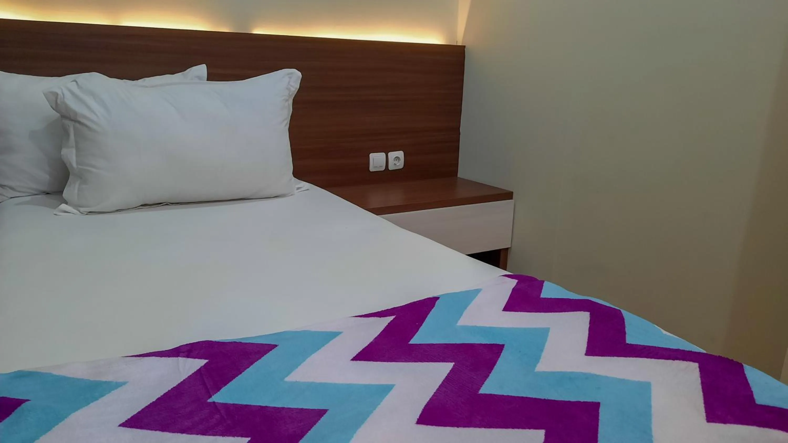 Bed in The Peak Guest House