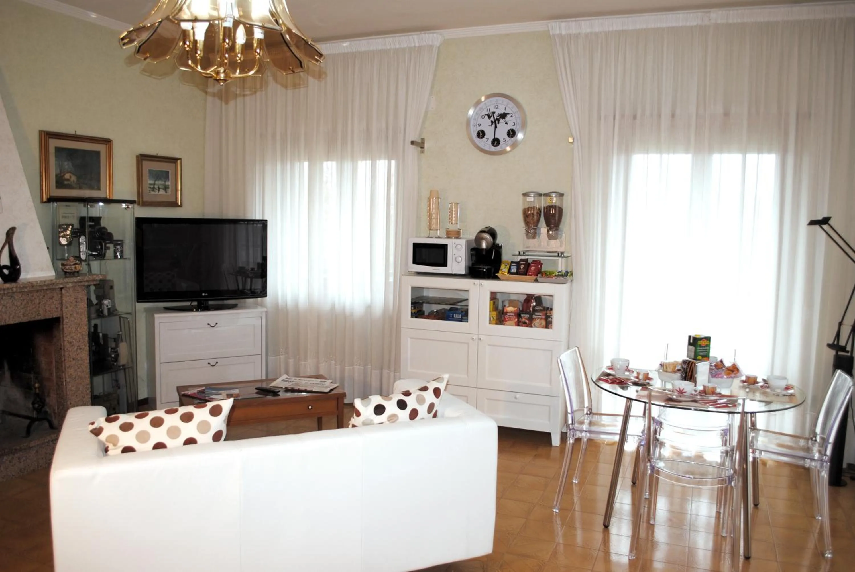 Communal lounge/ TV room in A casa di Gianna B&B