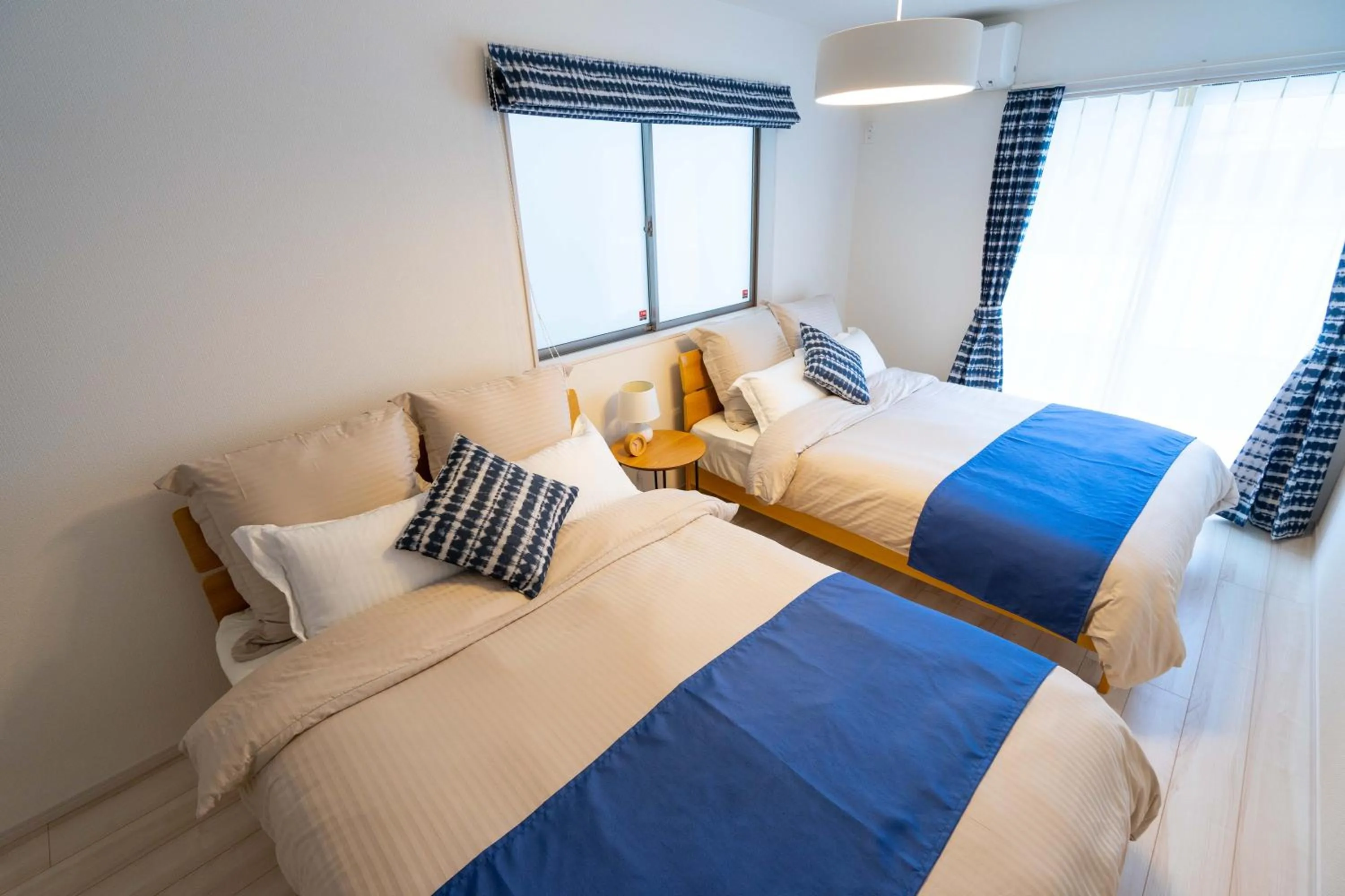 Photo of the whole room, Bed in OKINAWA BEACH HOUSE Golden Drop S