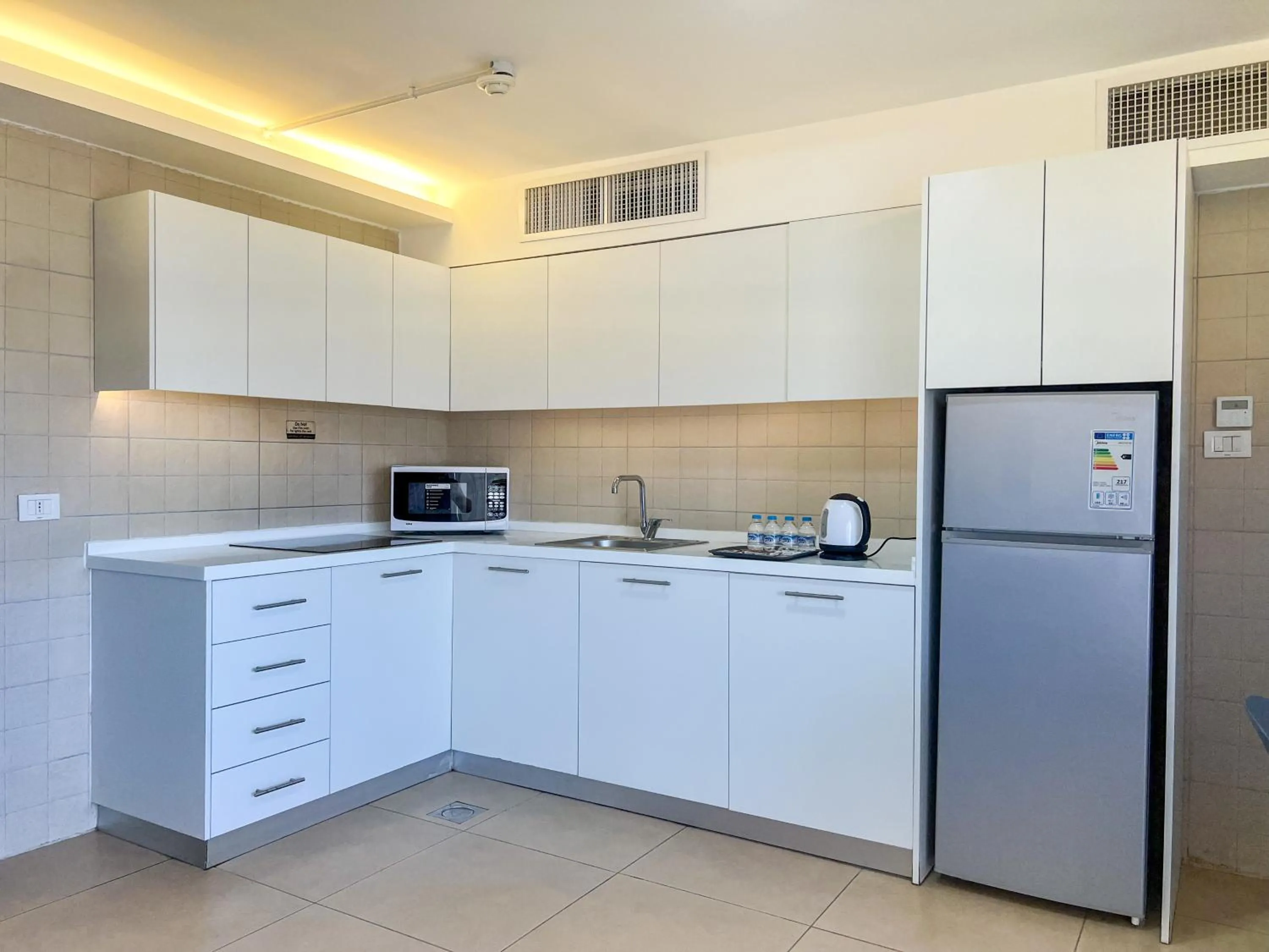 kitchen in Triple A Hotel Suites