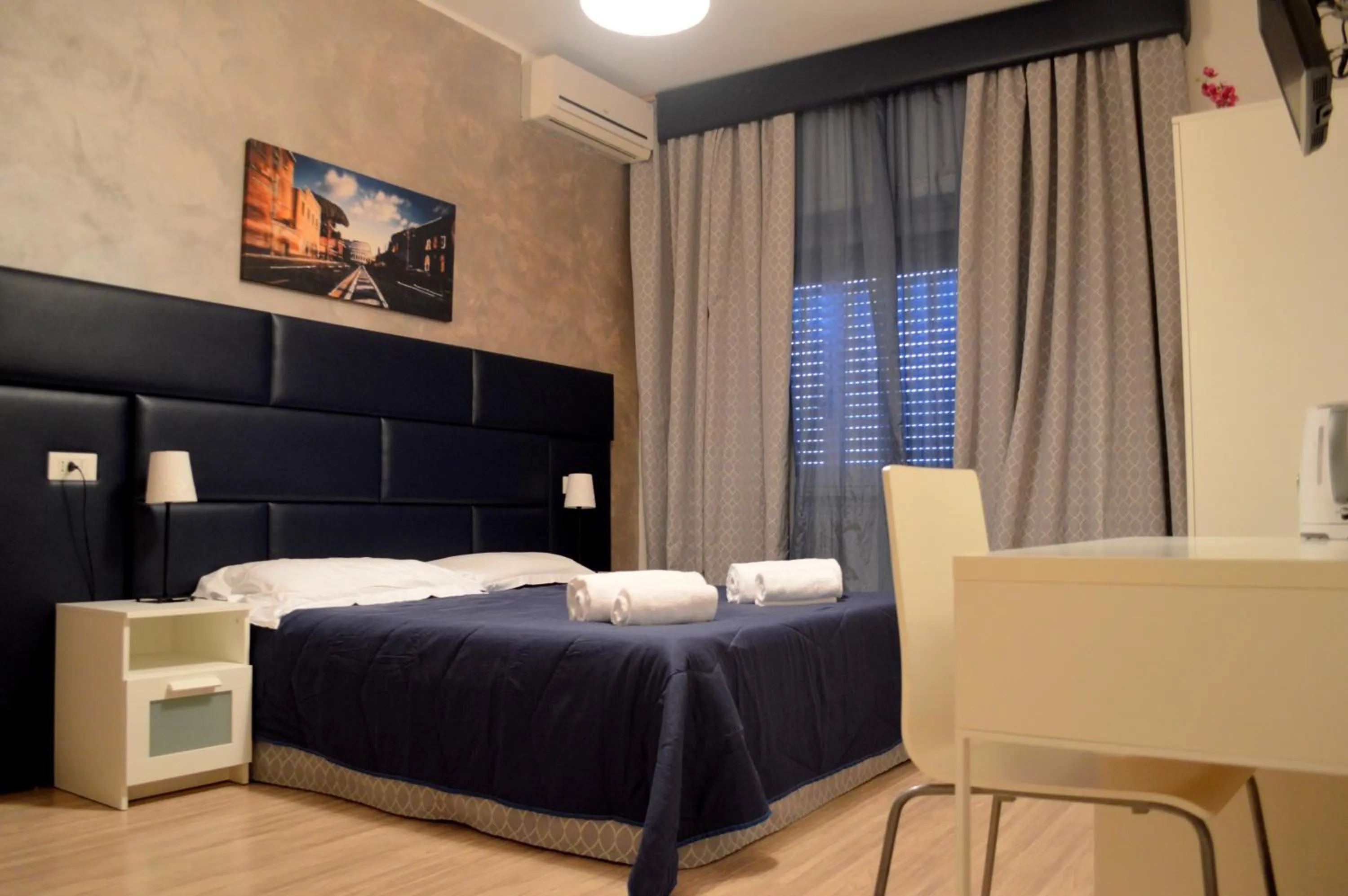 Photo of the whole room, Bed in Check-Inn Rooms